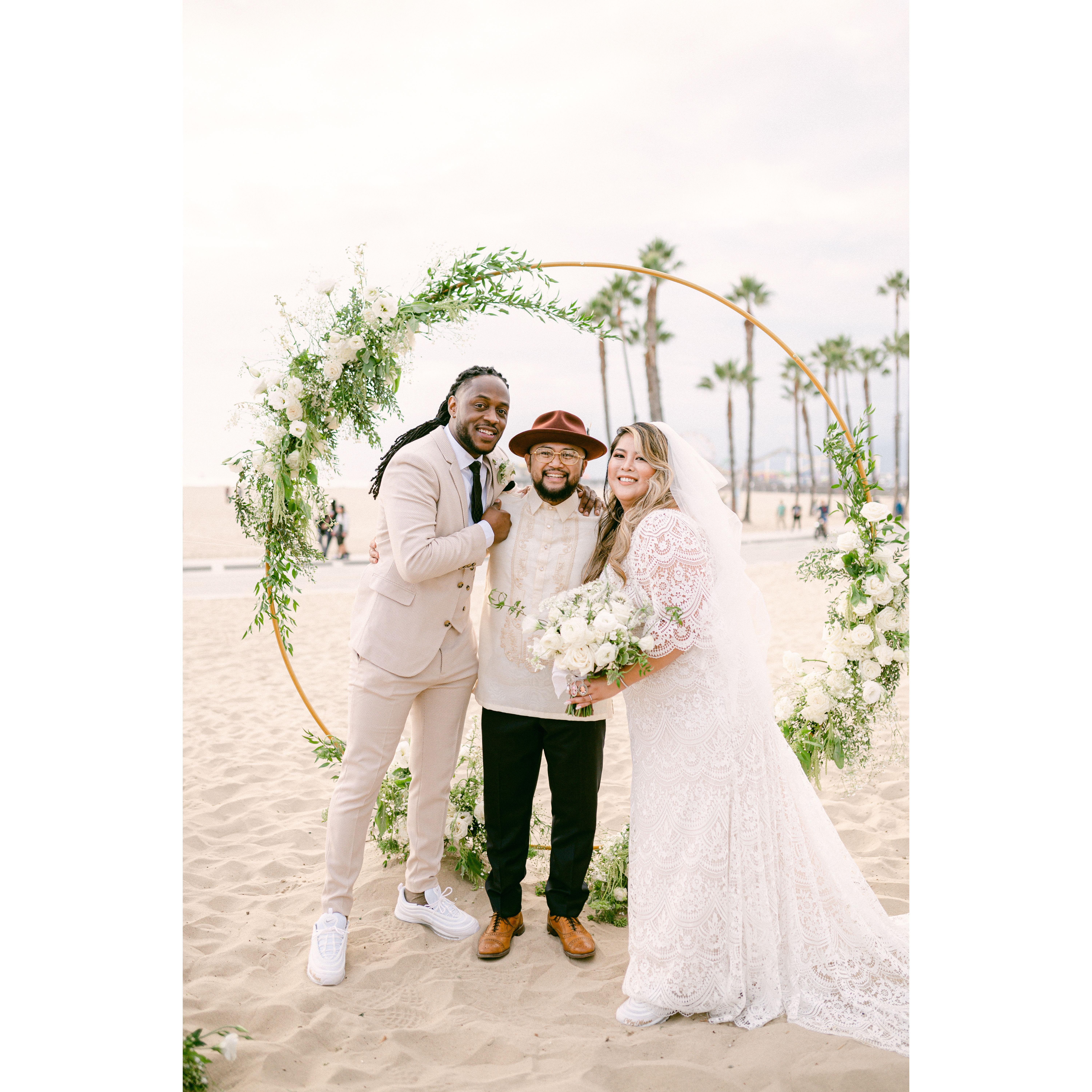 The Newlyweds with the best officiant ever, Minister Leo!