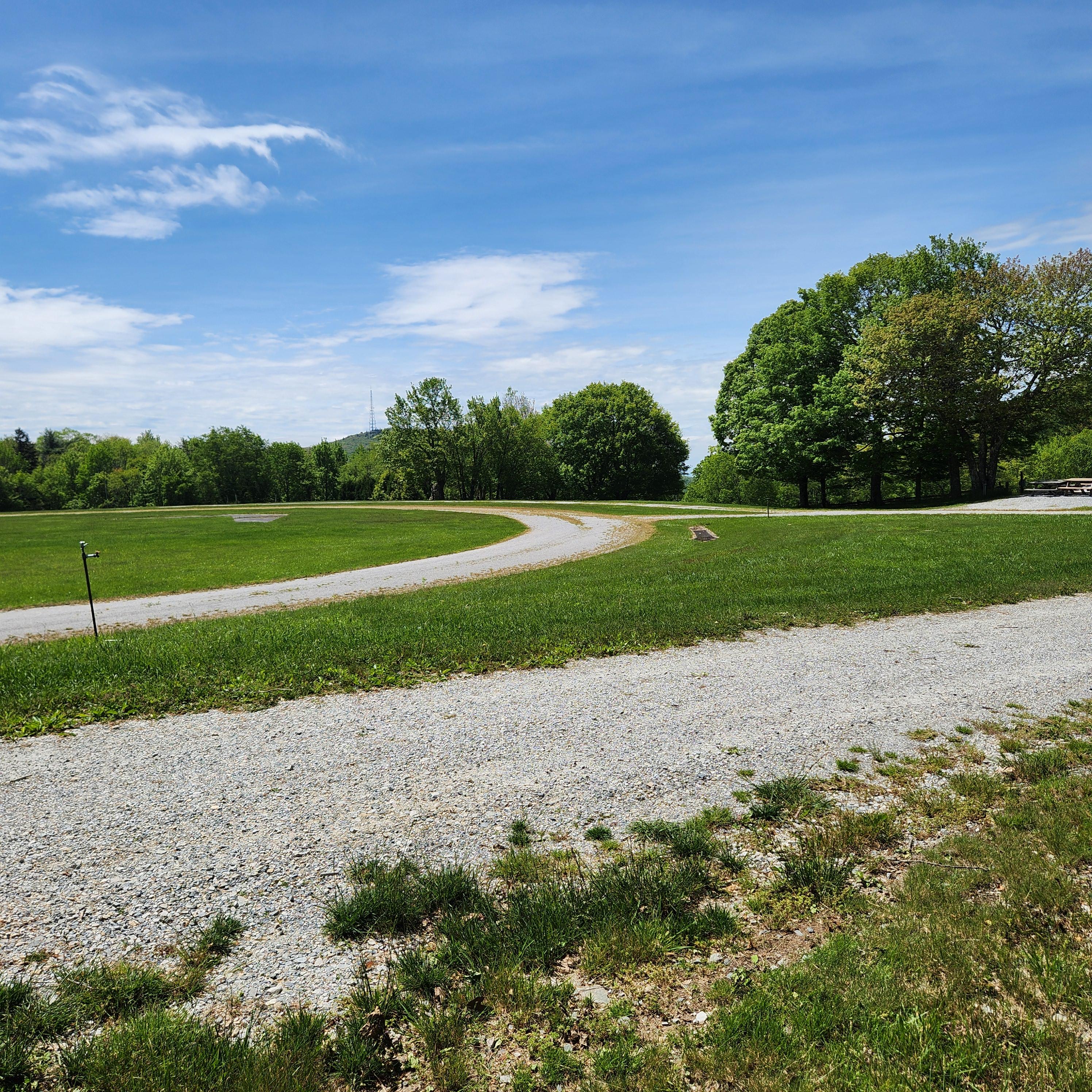 After the ceremony, we will follow this path around the athletic field. The inner gravel circle (in the background) will be surrounded by canvas tents for the Highland games.