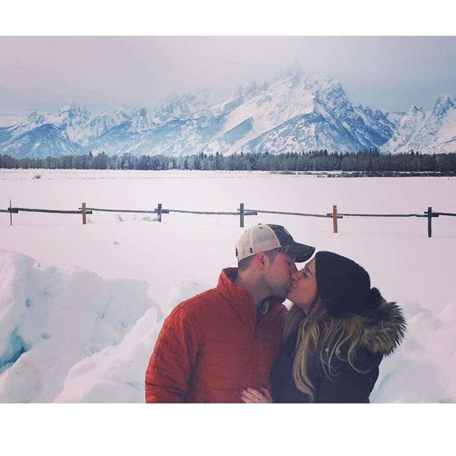 He had  just proposed to me and a lovely family came by and took our photo. He proposed to me right in front of the Grand Tetons, WY. Best day ever
