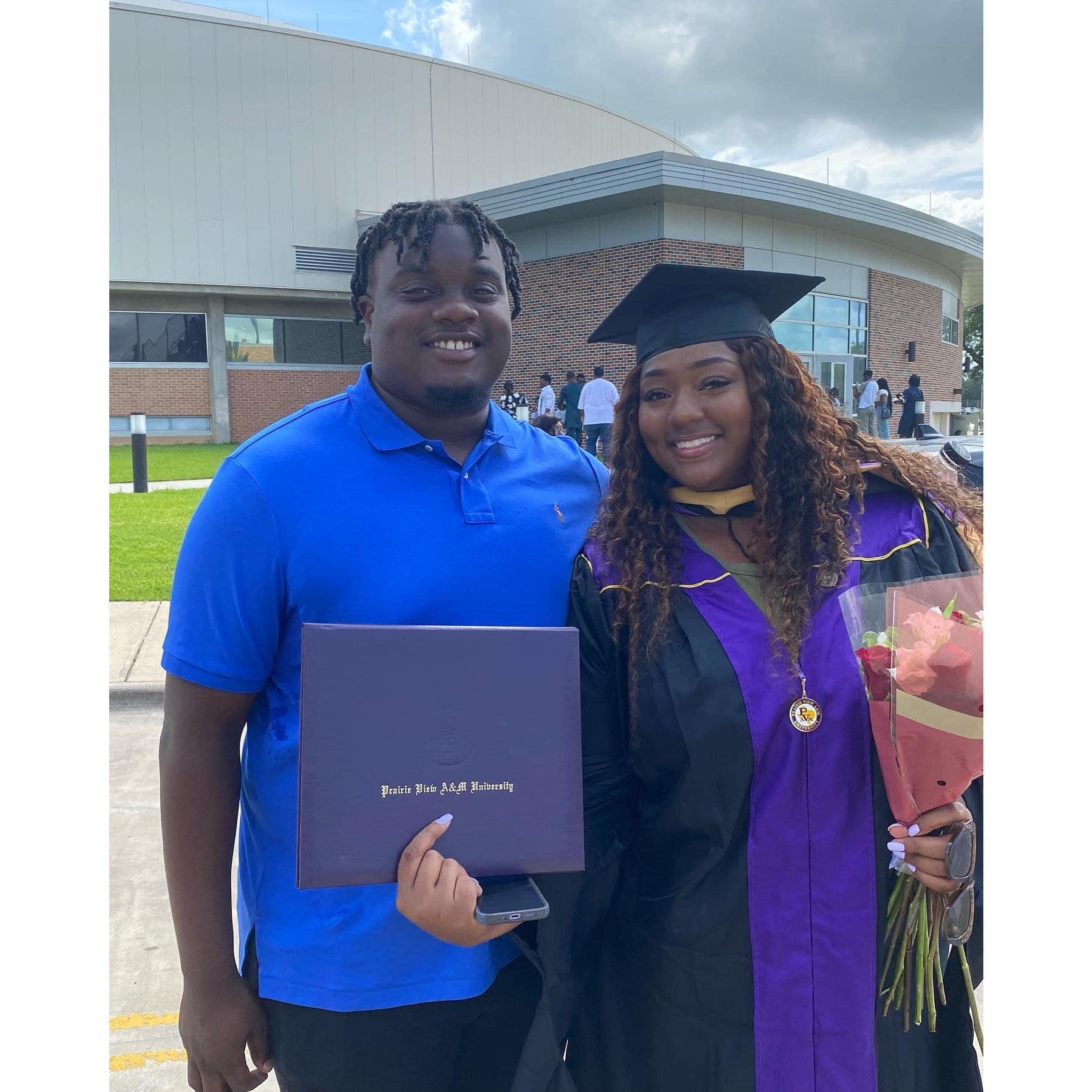 My Fiancé supporting me at graduation even through the blazing hot and humid weather!