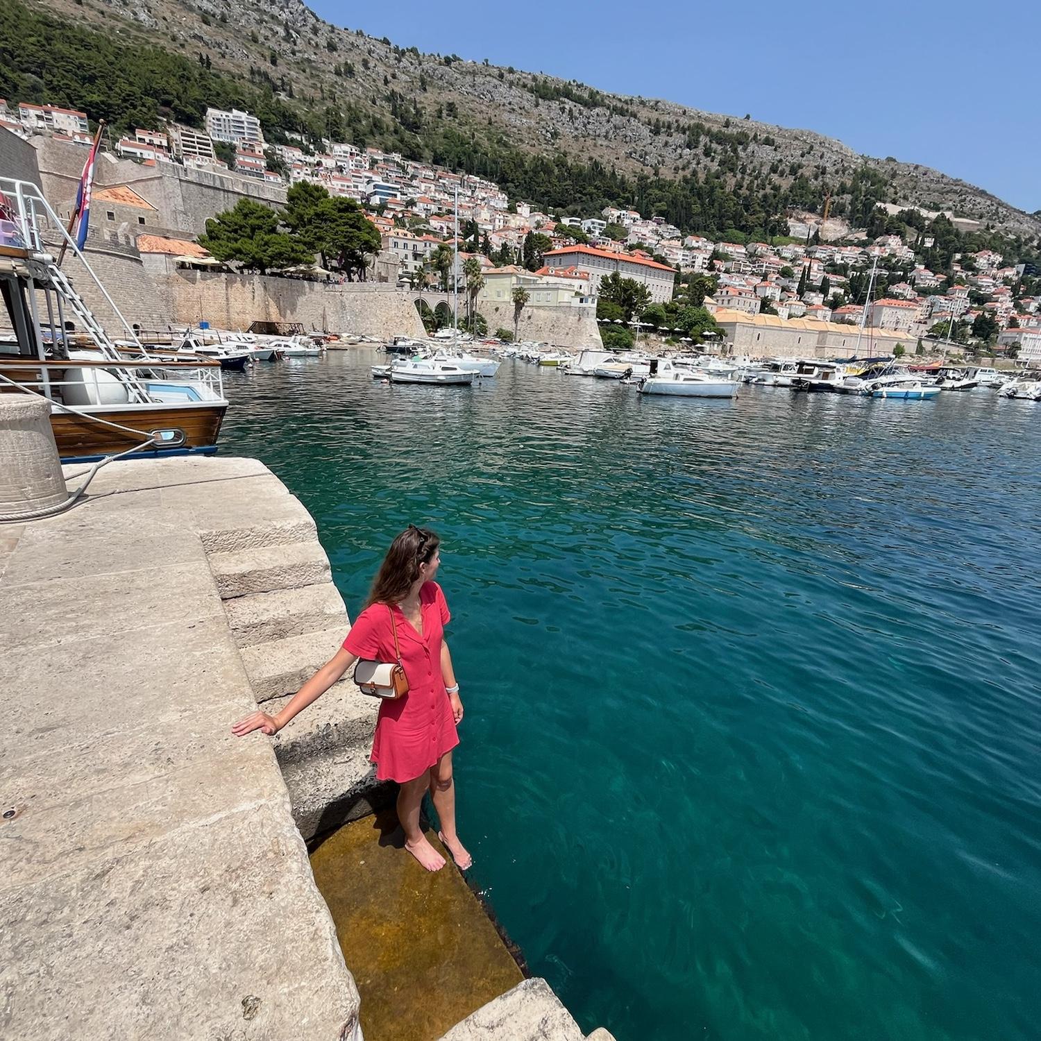 Dubrovnik harbor trying to cool off by sticking our feet in the water