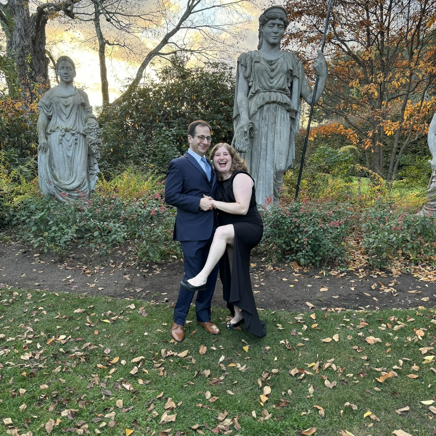 Posing with statues at a wedding in Wellesley, MA