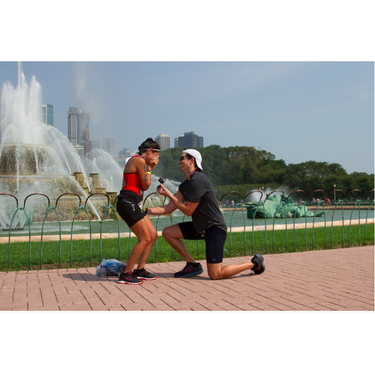 What is happening?! Talk about a surprise! Right in front of Chicago's beautiful and iconic Buckingham Fountain after the Triathlon! He did well.  PS. The same fountain is on our save the dates!
