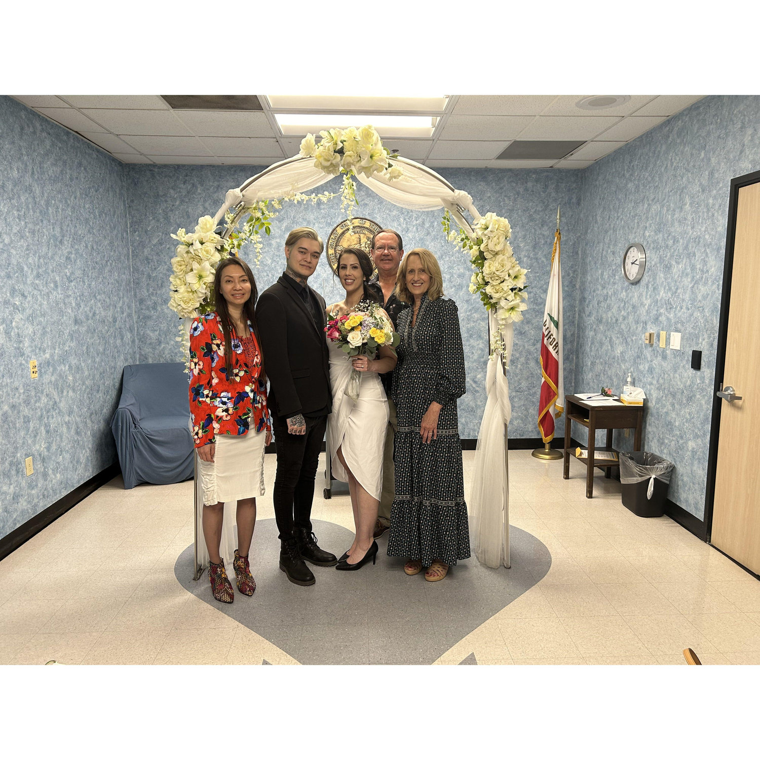 Us and our parents at our civil ceremony on October 12, 2023