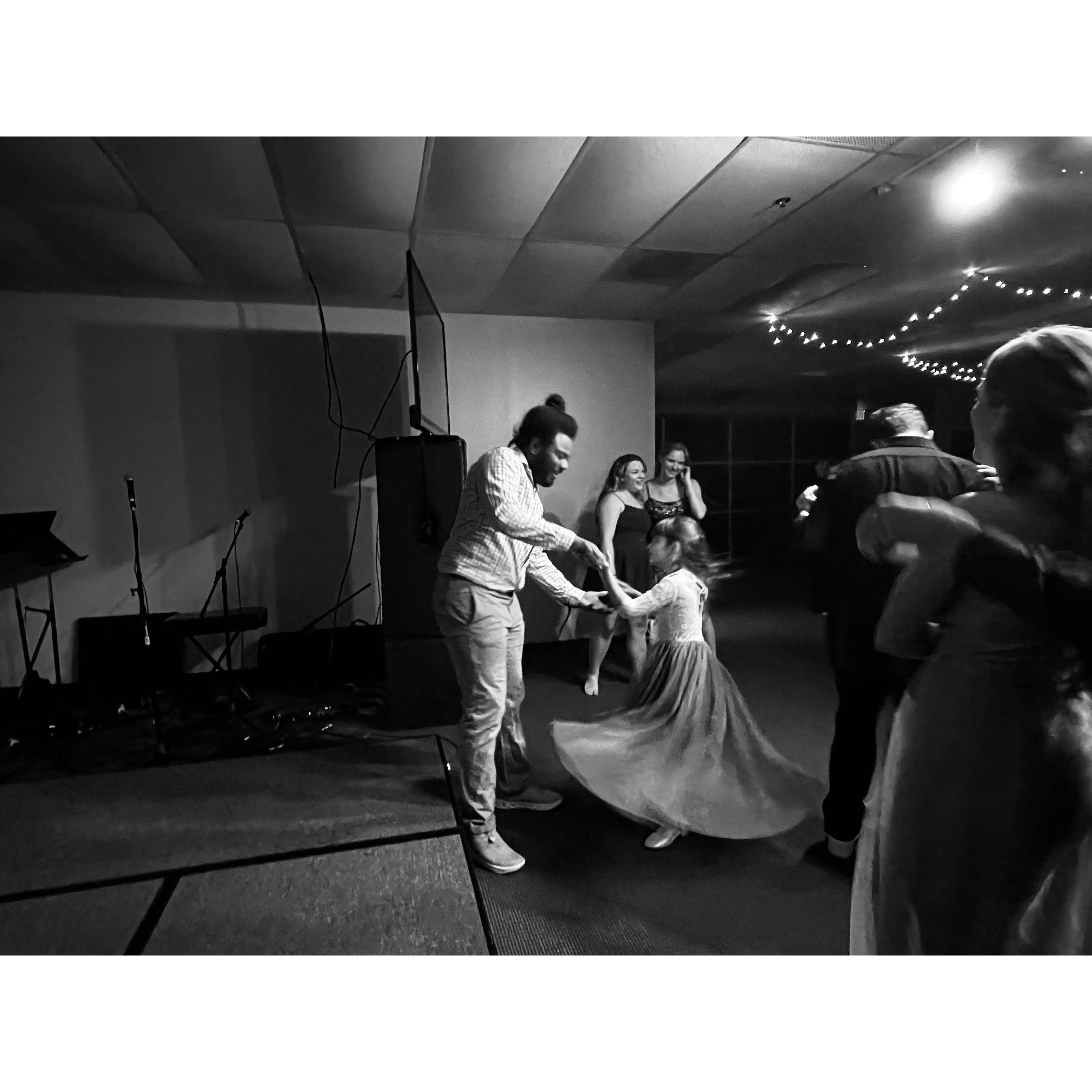 Sam dancing with one of the Demaris' at Paul's birthday party