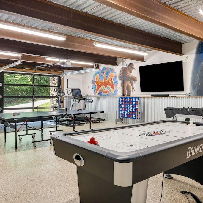 Game room equipped with ping pong, air hockey, and more