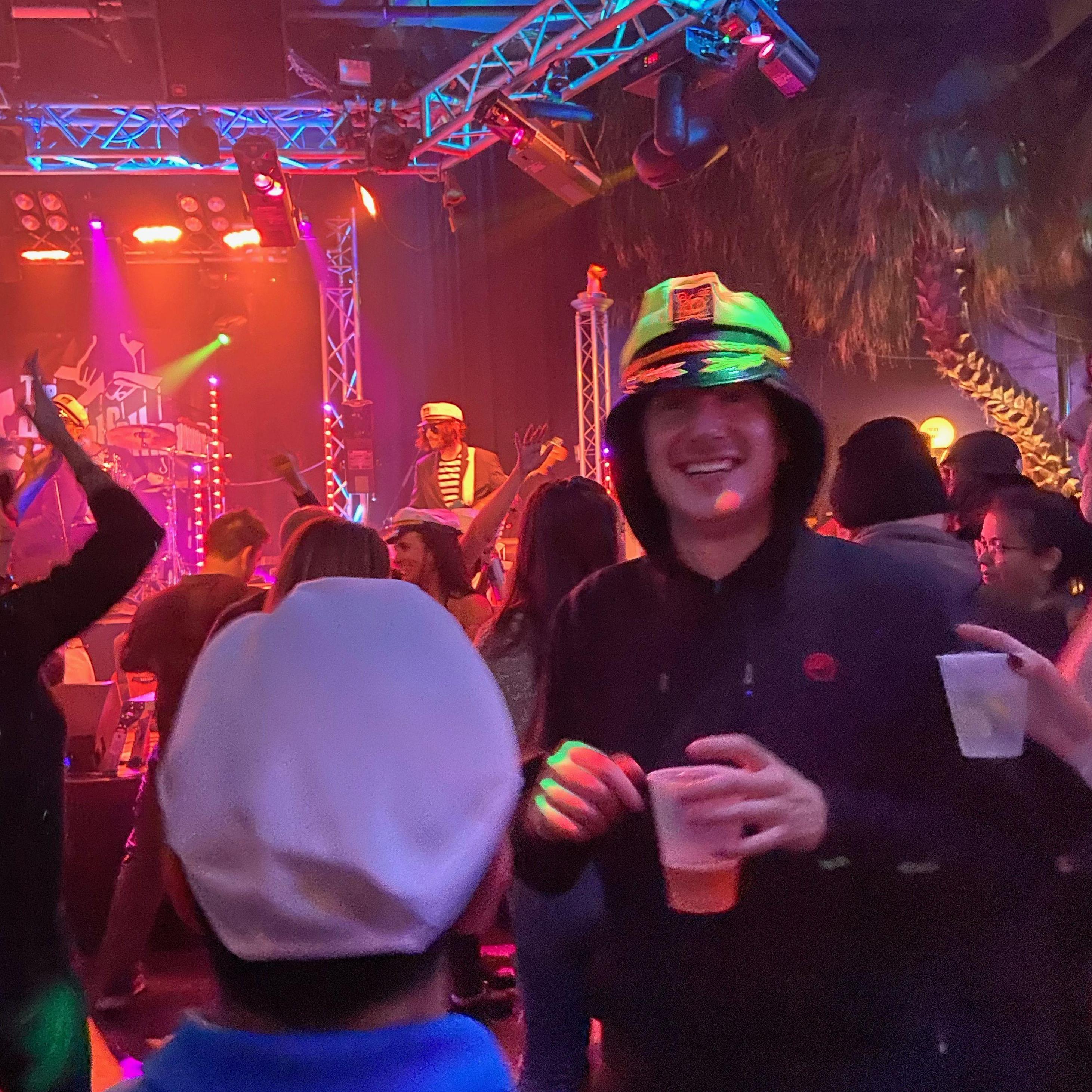 Tim in his absolute prime watching the Yacht Fathers at the Cove (ft the back of Jimmy's head)