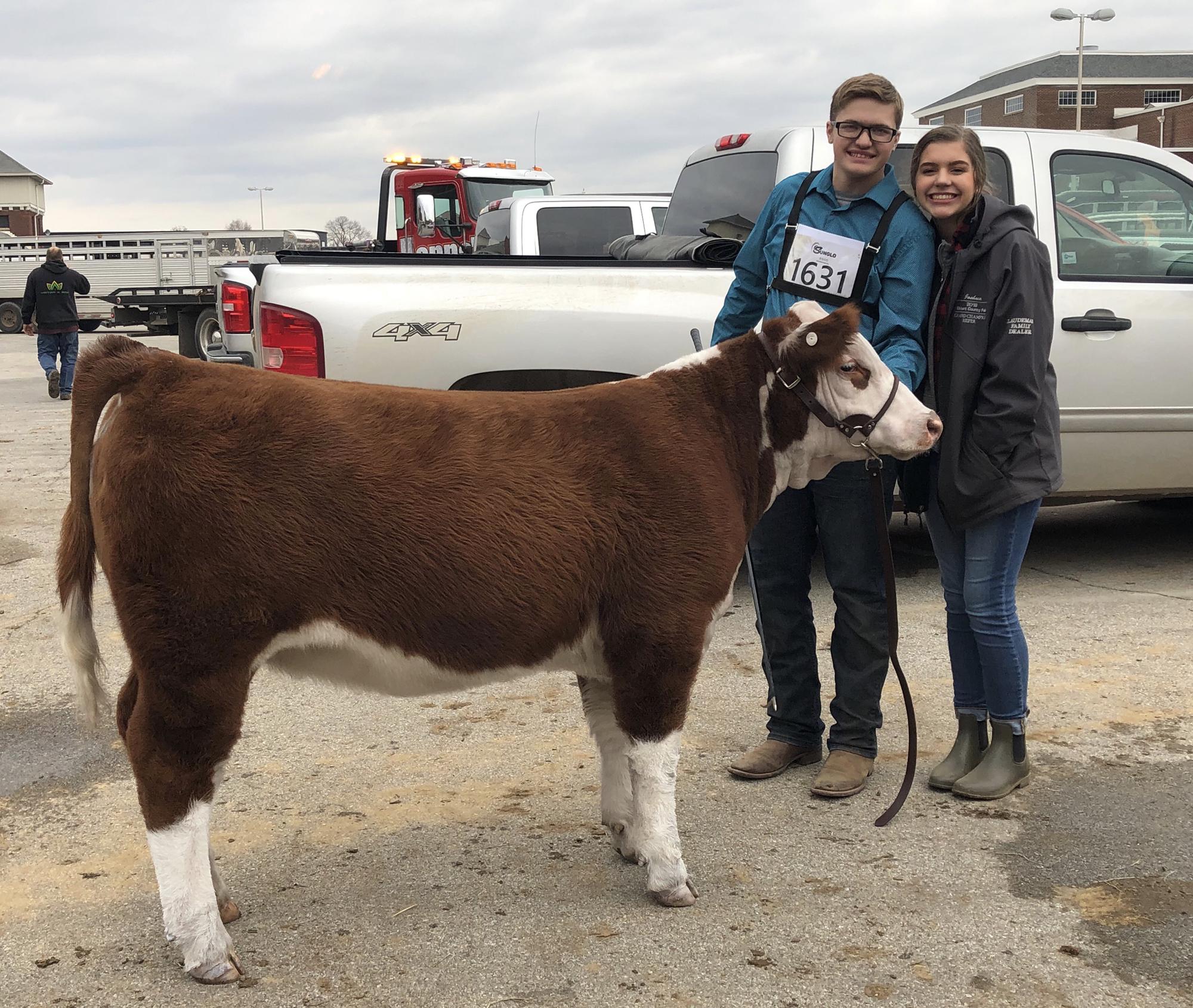 This picture was taken at our first Beef Congress together down in Indy. Joining us in this photo is Lilly Josh's Hereford heifer that he was showing. December 8, 2019