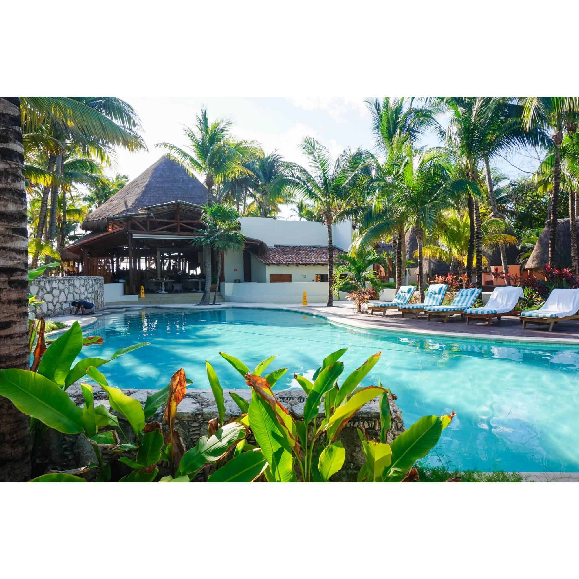One of Mahekal's many pools alongside one of their in-resort restaurants.
