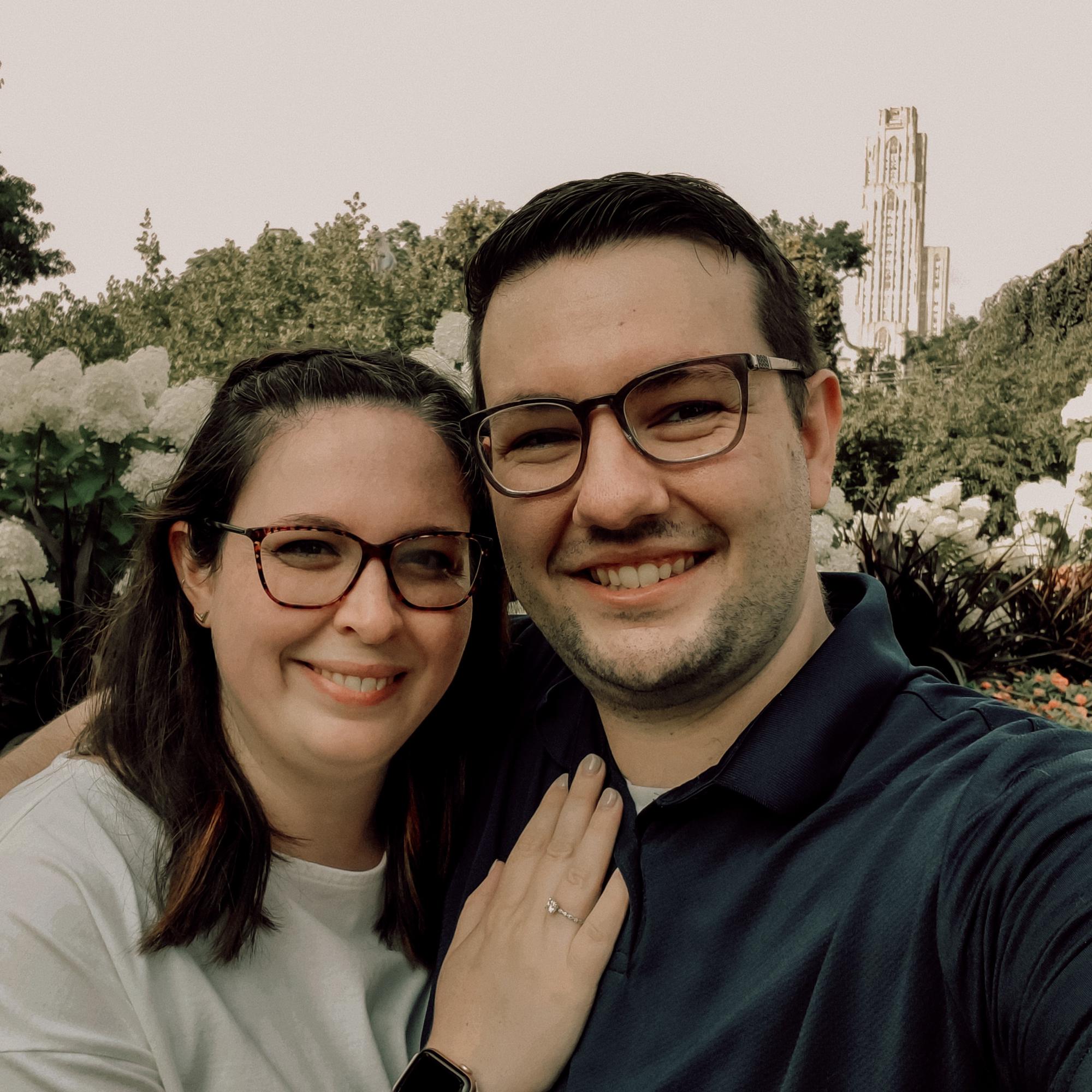 Gary proposed in the outdoor gardens at Phipps Conservatory with views of the Cathedral of Learning in the background. (Aug 2021)