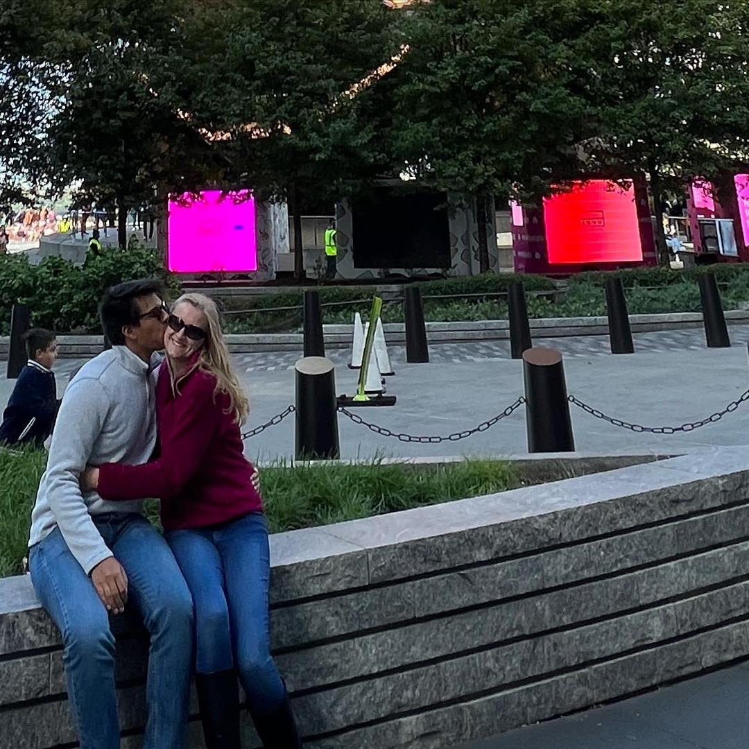 In NYC in front of a funky shaped building!