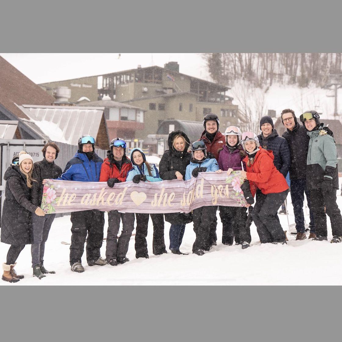 The Hadbavny family surprising Erin at the bottom of the mountain with everyone!