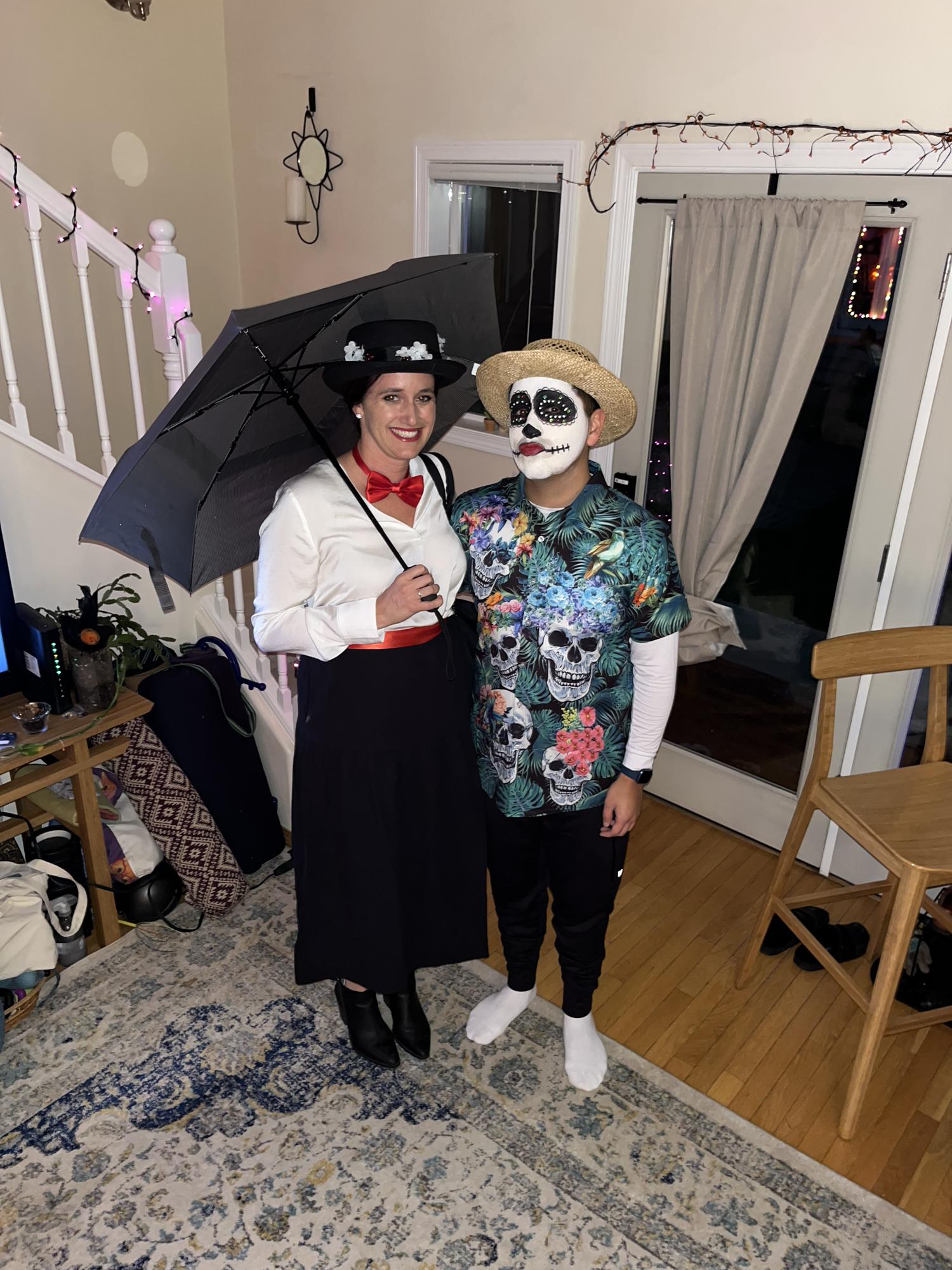 Halloween 2022! Rosemary dressed as Mary Poppins while Aaron is a Dia de los Muertos Chicano on vacation.