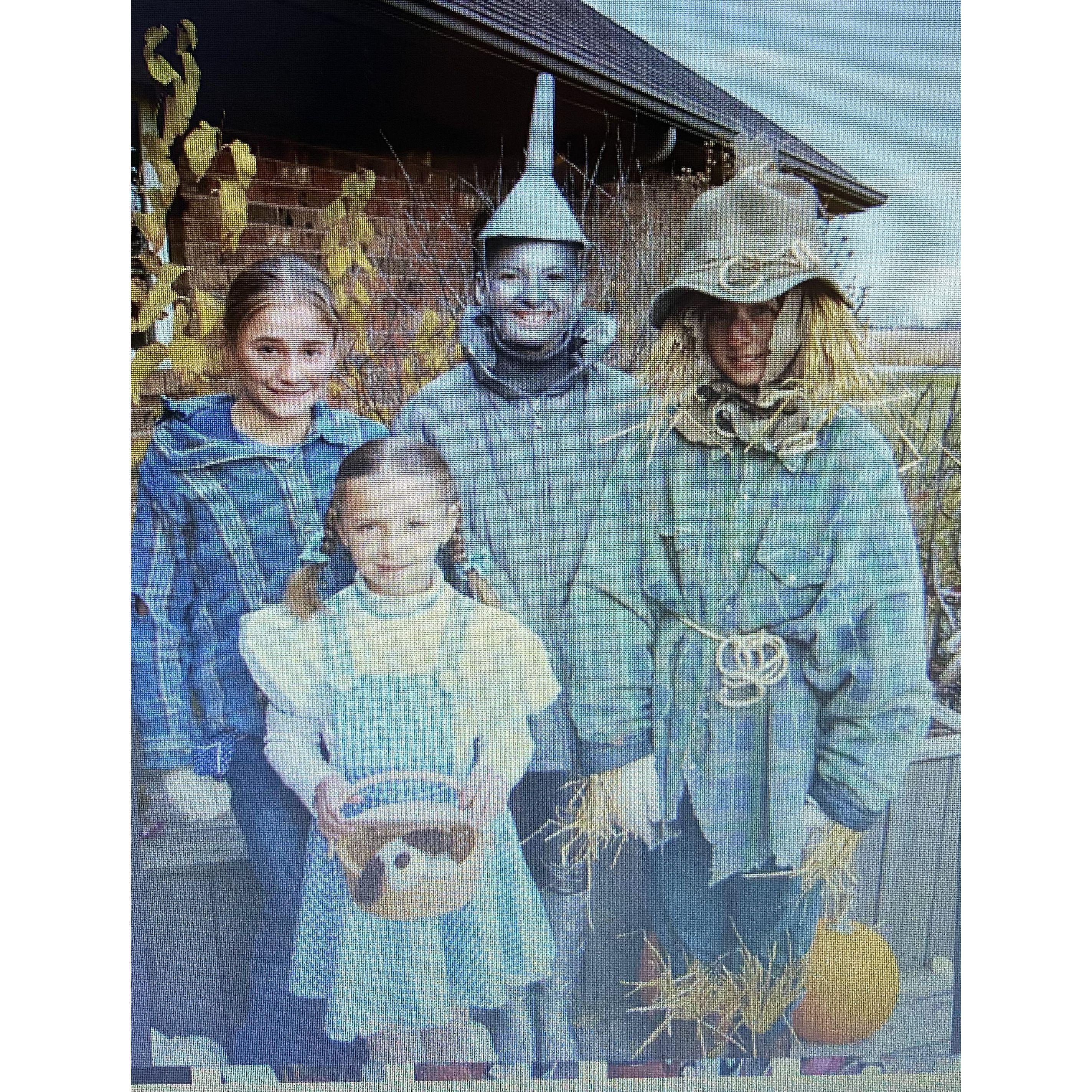 Rubie and her siblings and a friend dressed as Wizard of Oz characters for Halloween