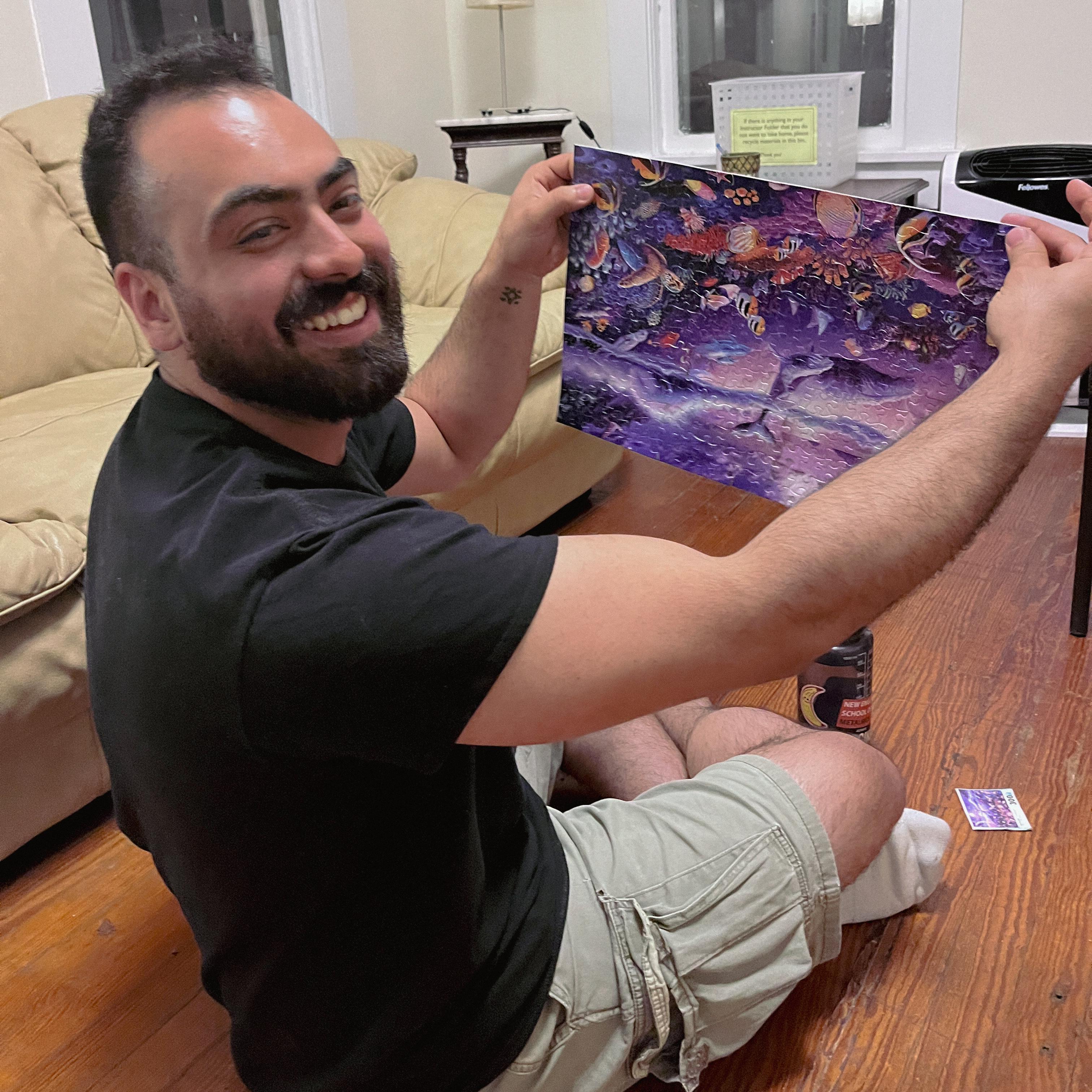 This is the first picture Taylor took of Emiliano. We had just finished a puzzle very early in the morning while teaching at Peters Valley School of Craft in 2022. He didn't realize he picked it up upside down.