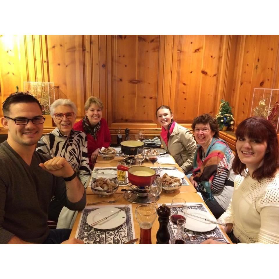 Enjoying fondue with Anna's family in Switzerland.