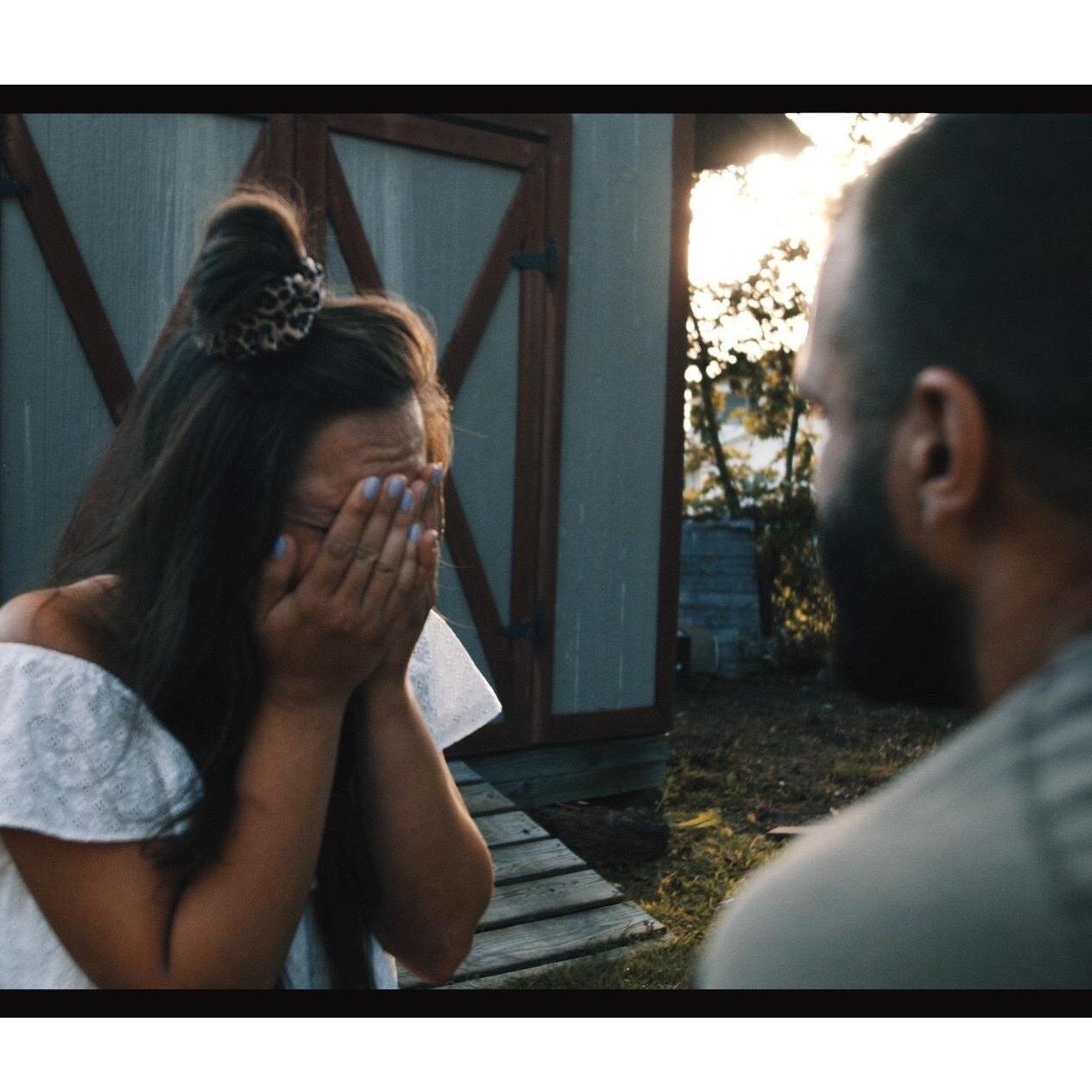 Tj got down on his knee to propose as this picture was taken