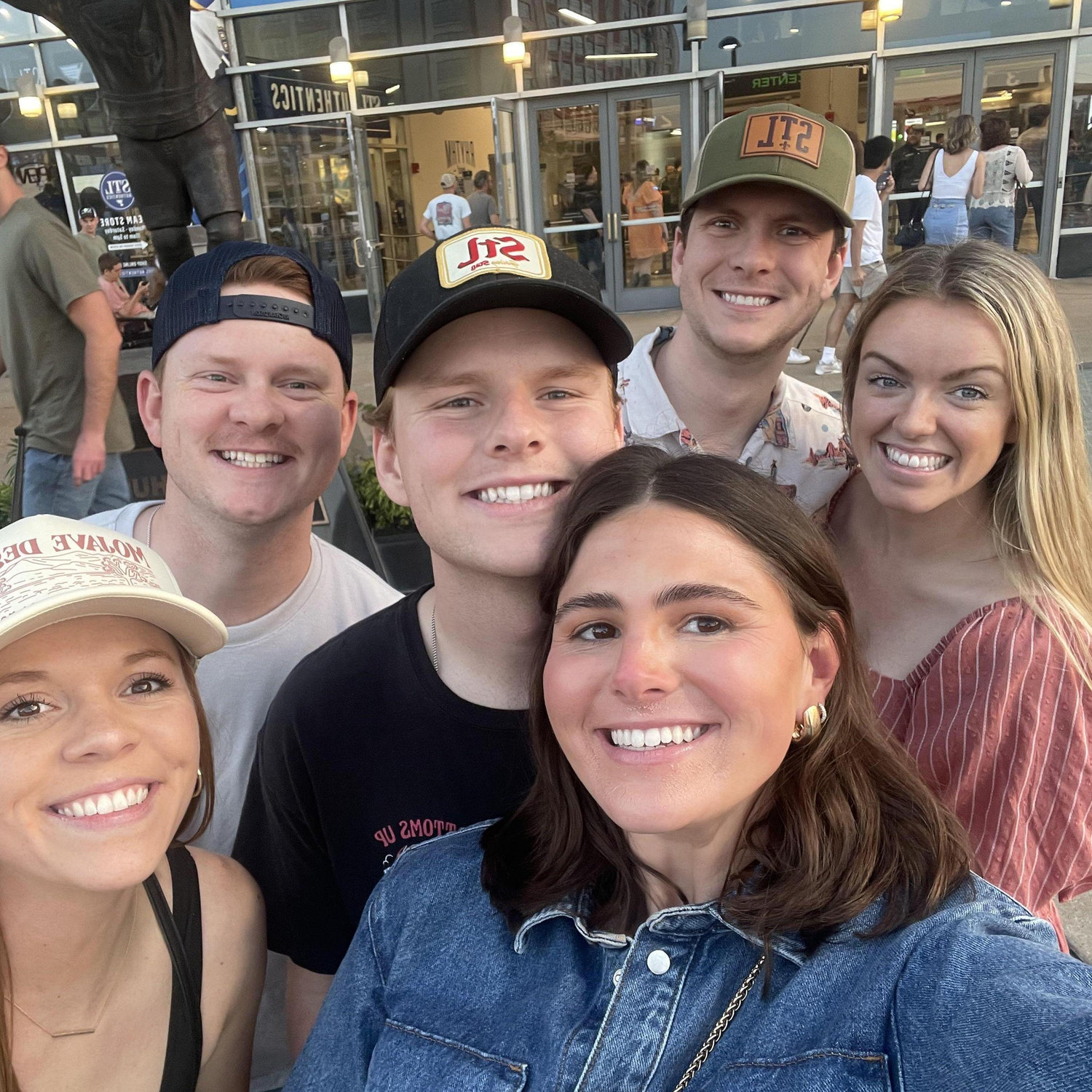 Kyle, Kelly, and Kyle's brothers and their wives before Zach Bryan!