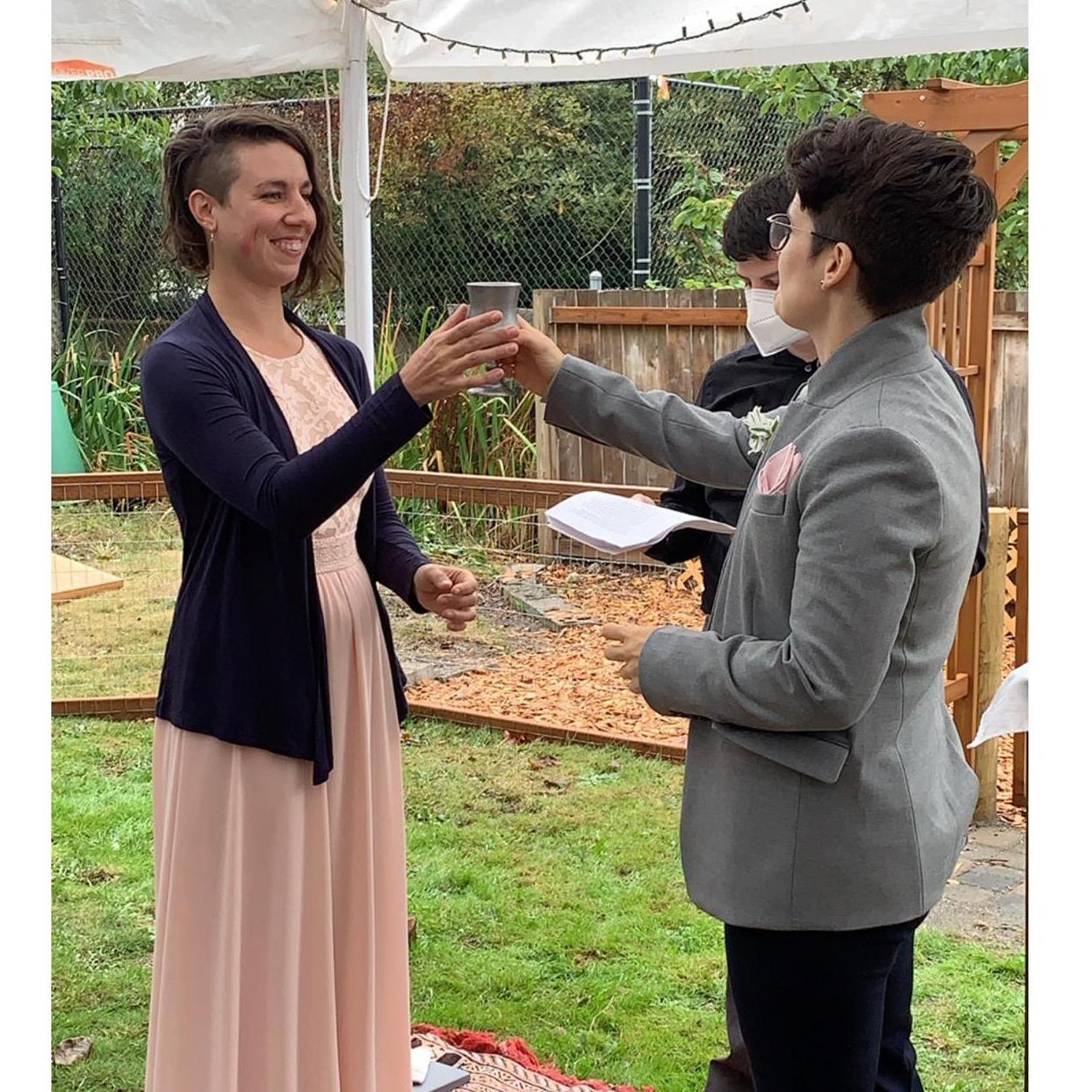 “In the spirit of tradition, Robin and Katie will share this glass of wine as a symbol of their interconnectedness with the earth and of our responsibility to tend to their relationships with care."