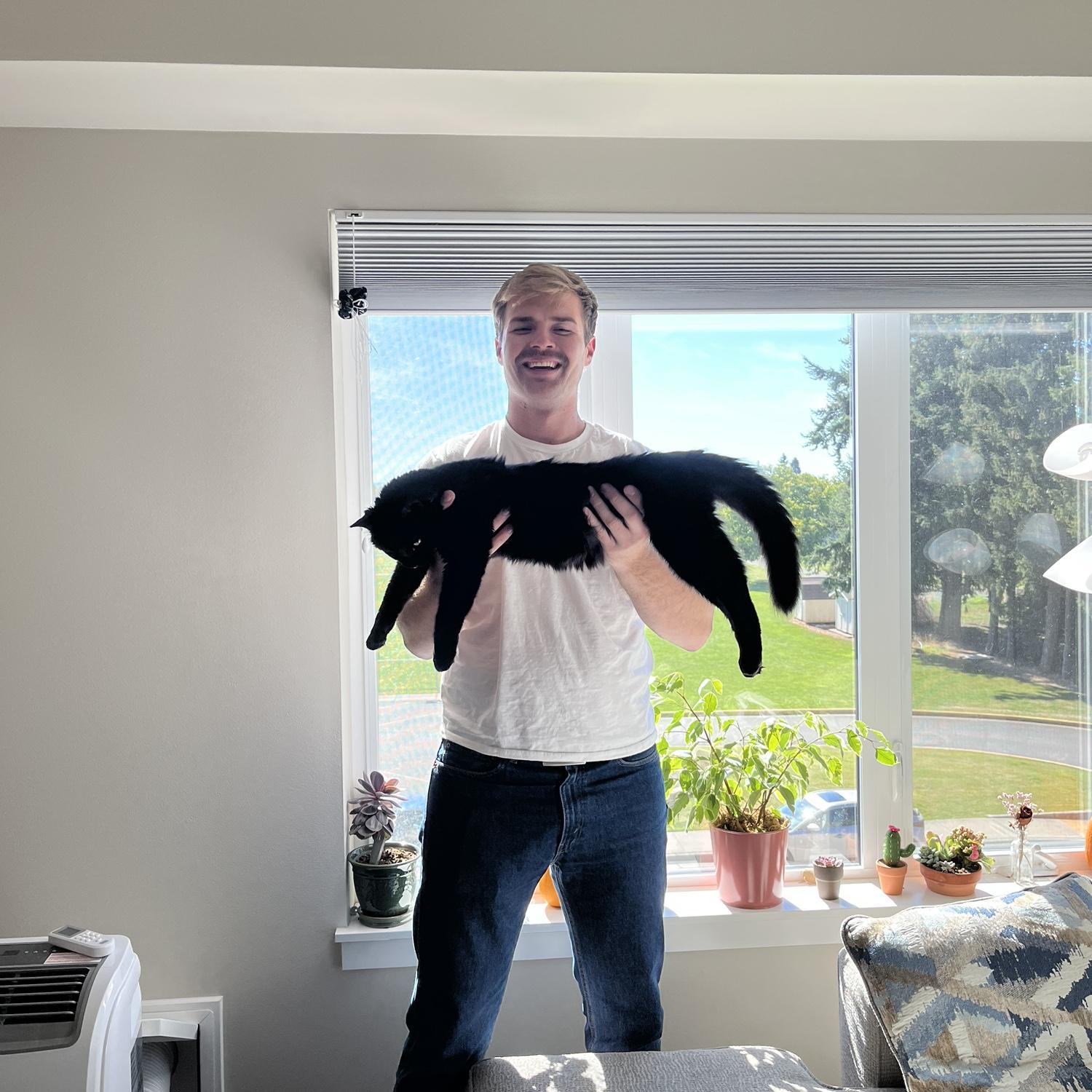 Jared and a very large cat named Colter