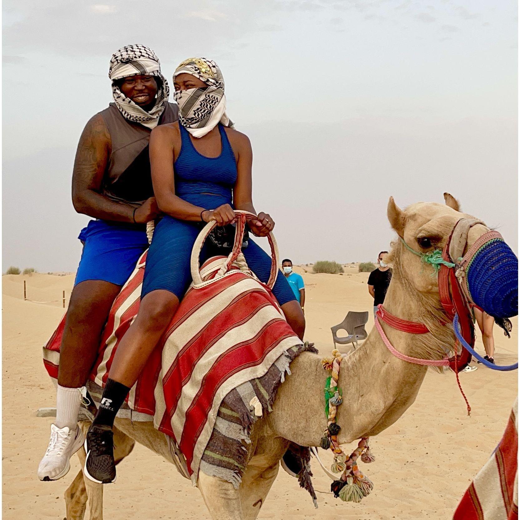 On the camels in Dubai! Our first international trip together.