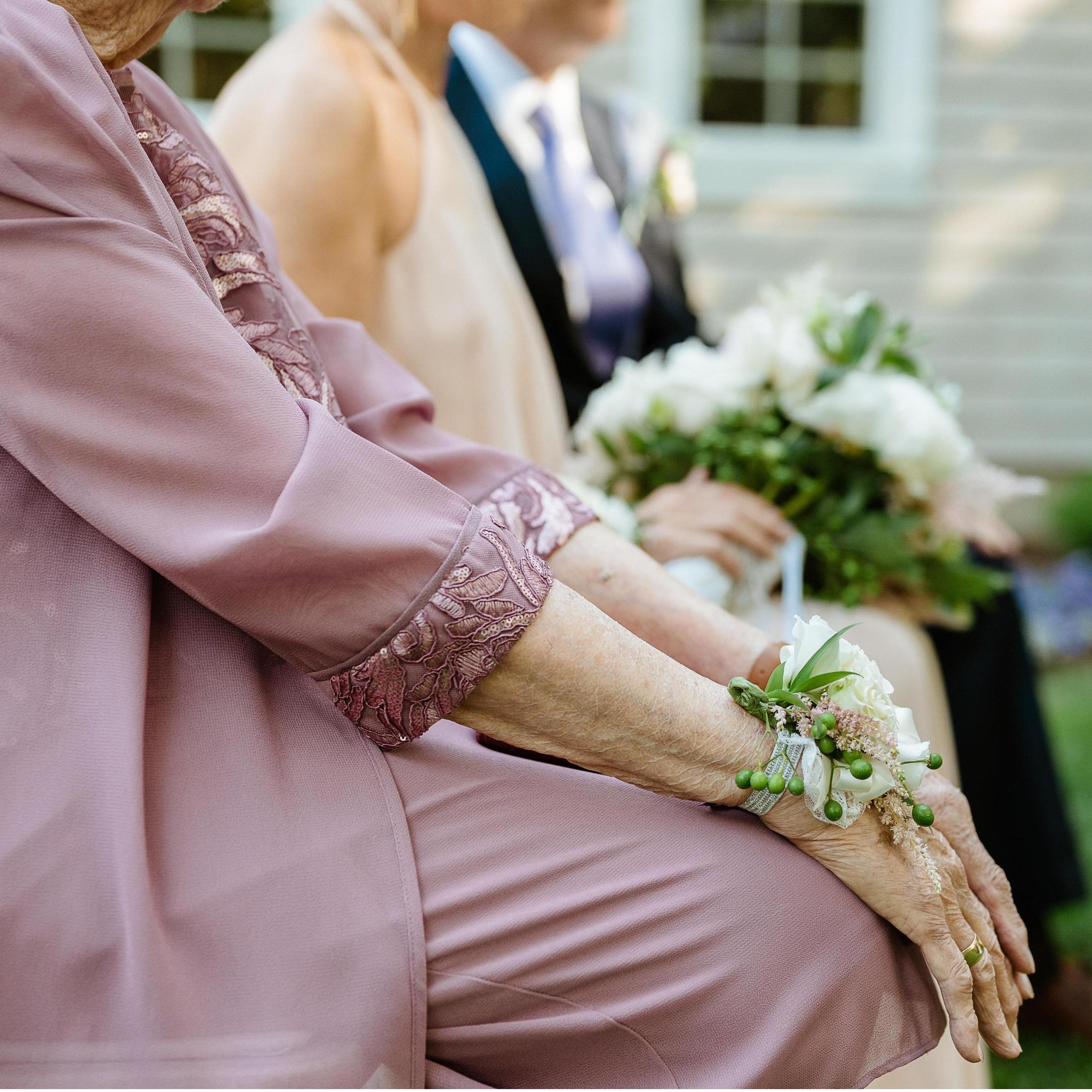 Corsages with pieces of Lauren's paternal grandmother's dress incorporated into the piece