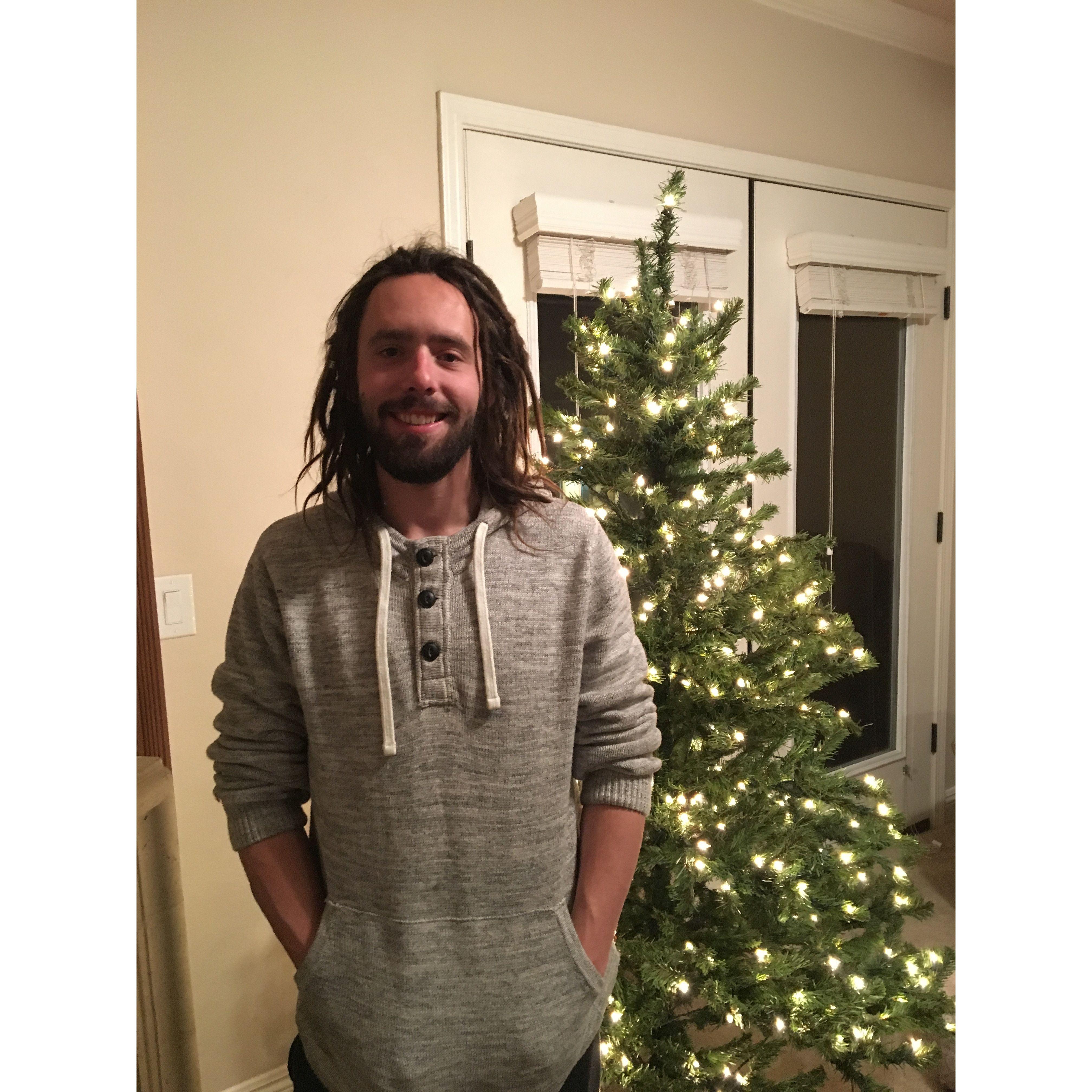 Tyler and our first Christmas tree, December 2018