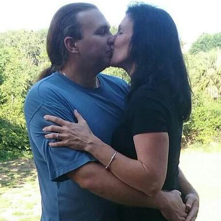 Chris proposed on Mother's Day. We went to tell family the same day and they snapped this great picture of us!
