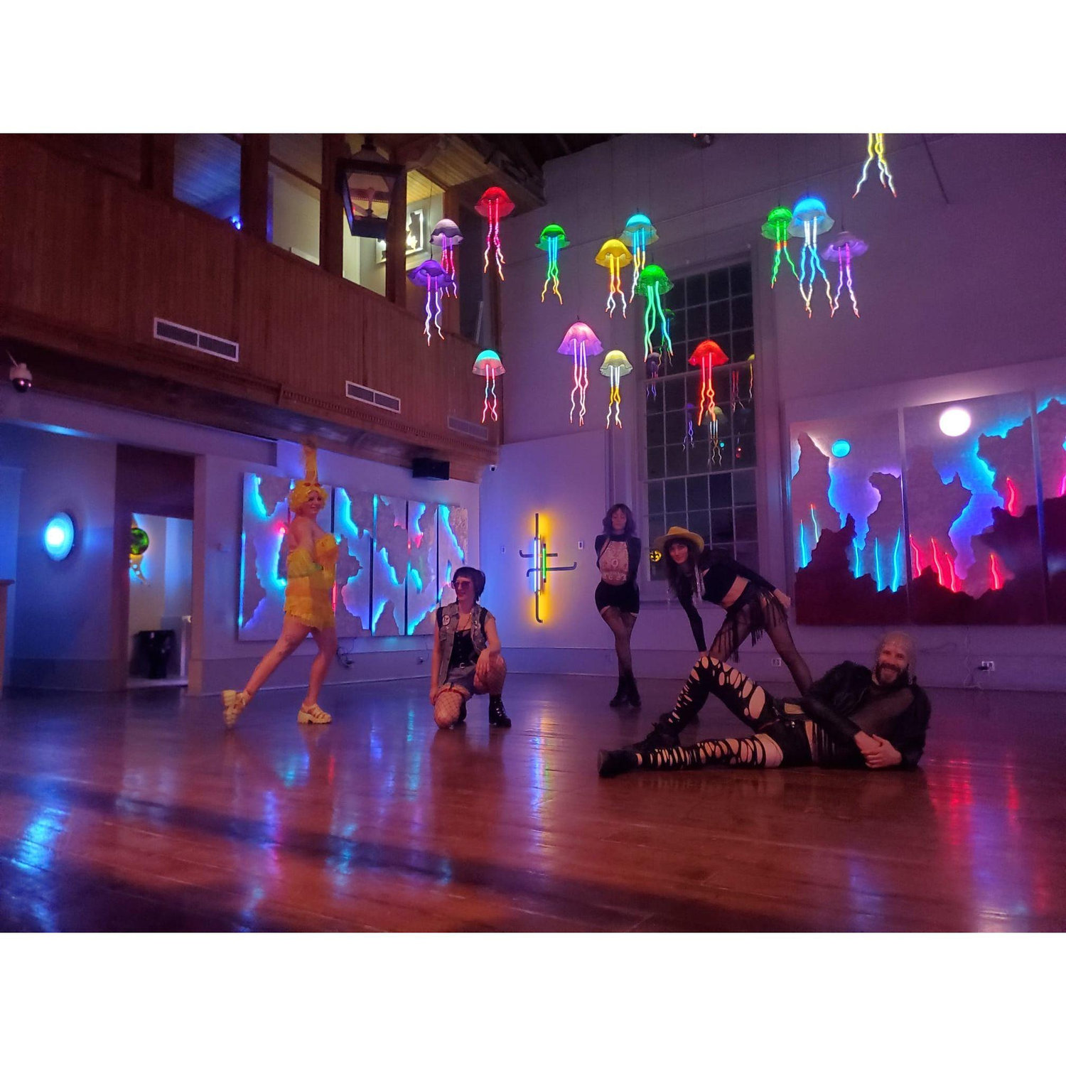 A group vogue moment with the neon art at the Venusian Gardens.