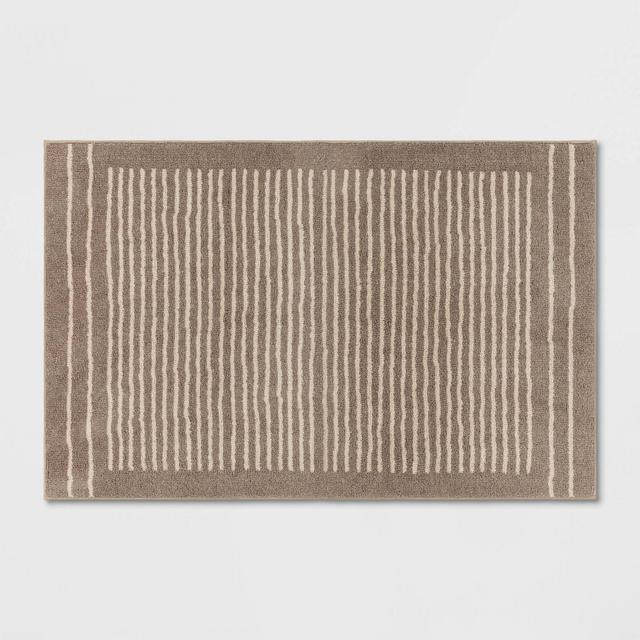 2'6"x4' Washable Knitted Stripe Accent Rug Tan - Threshold™