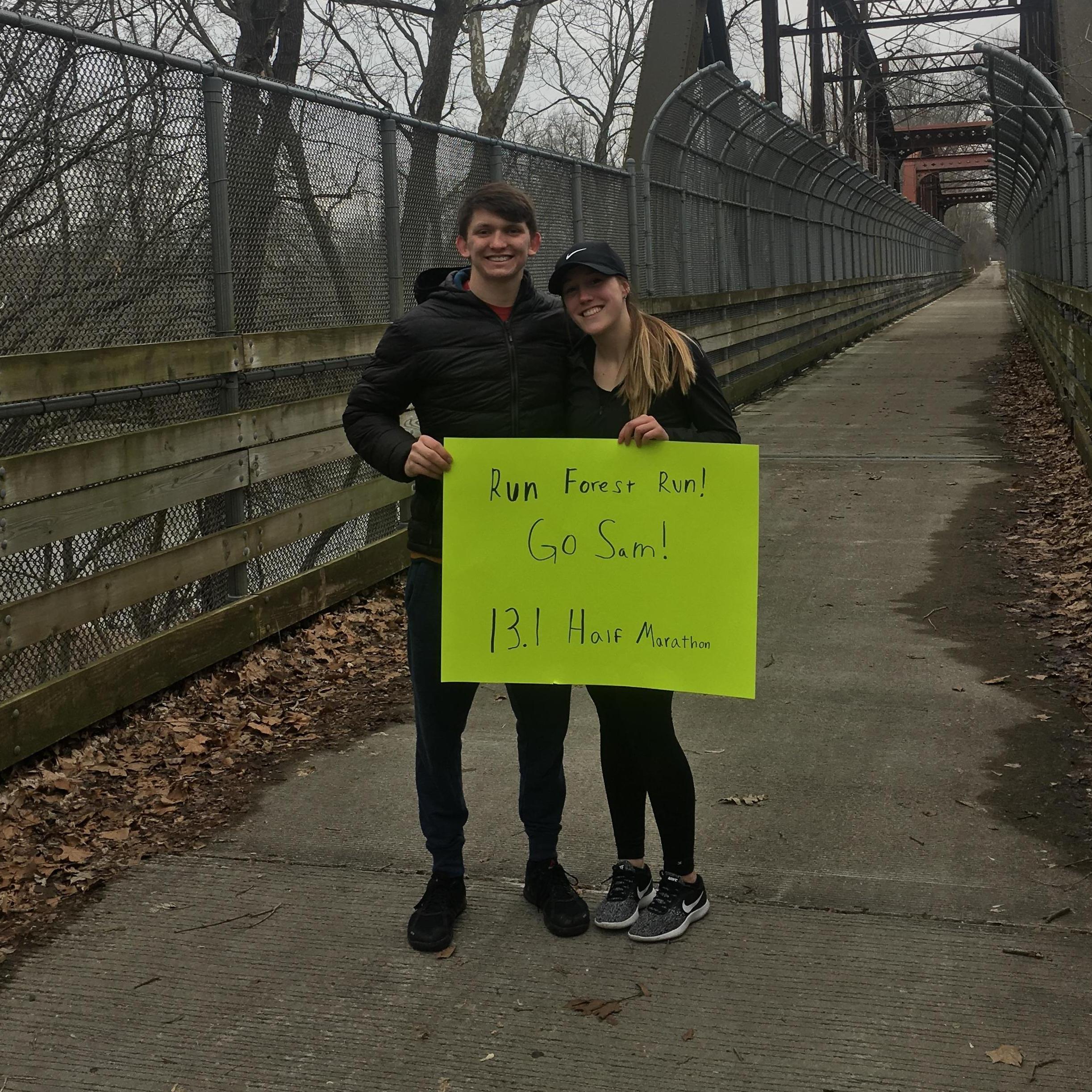 Austin cheering Sam on at her first half marathon in March 2019!