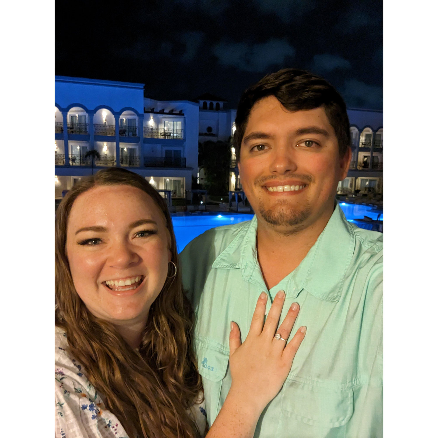 Tori and Tom on the balcony of their hotel room immediately following the proposal.
