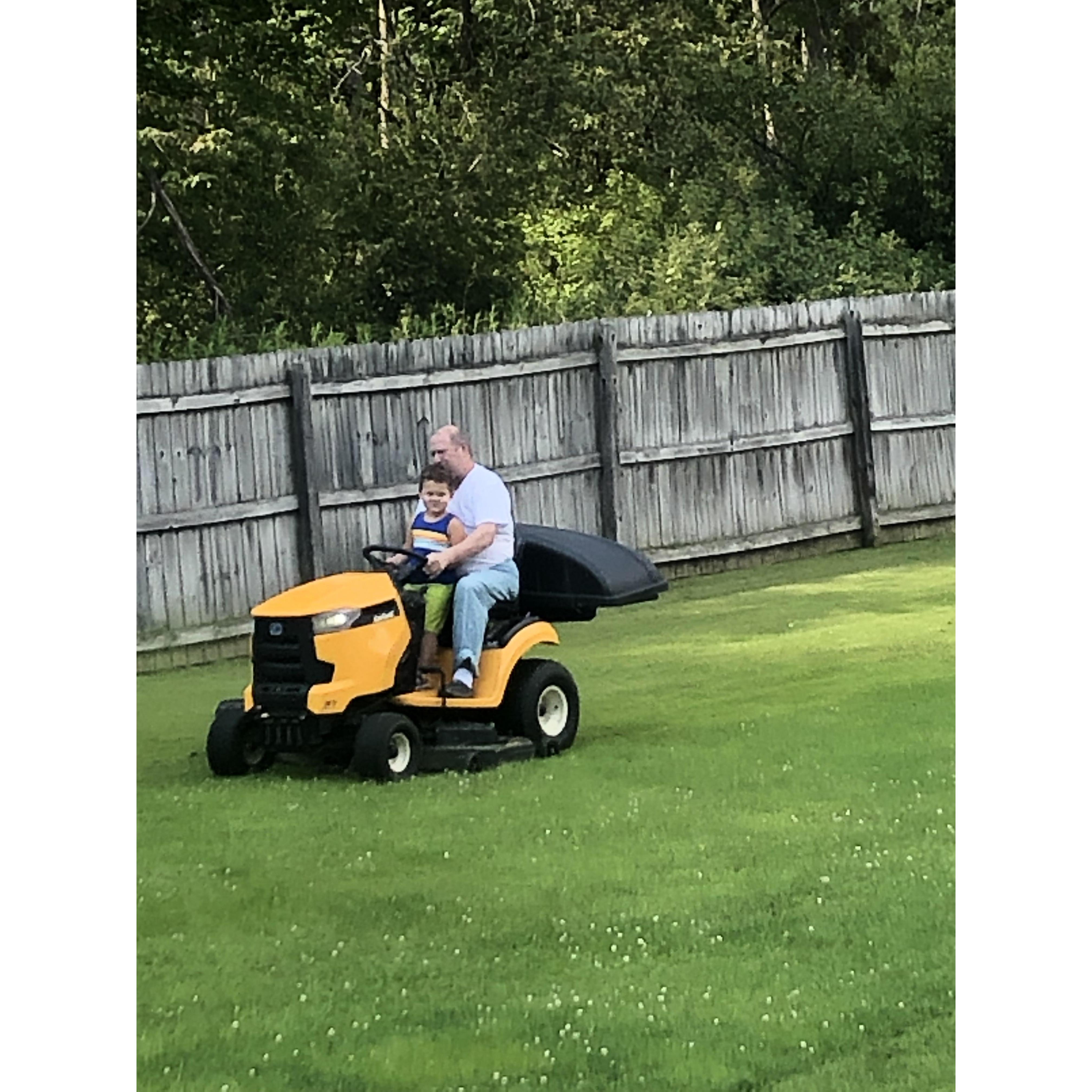 Riding the "mow-mower" with Uncle Keith.