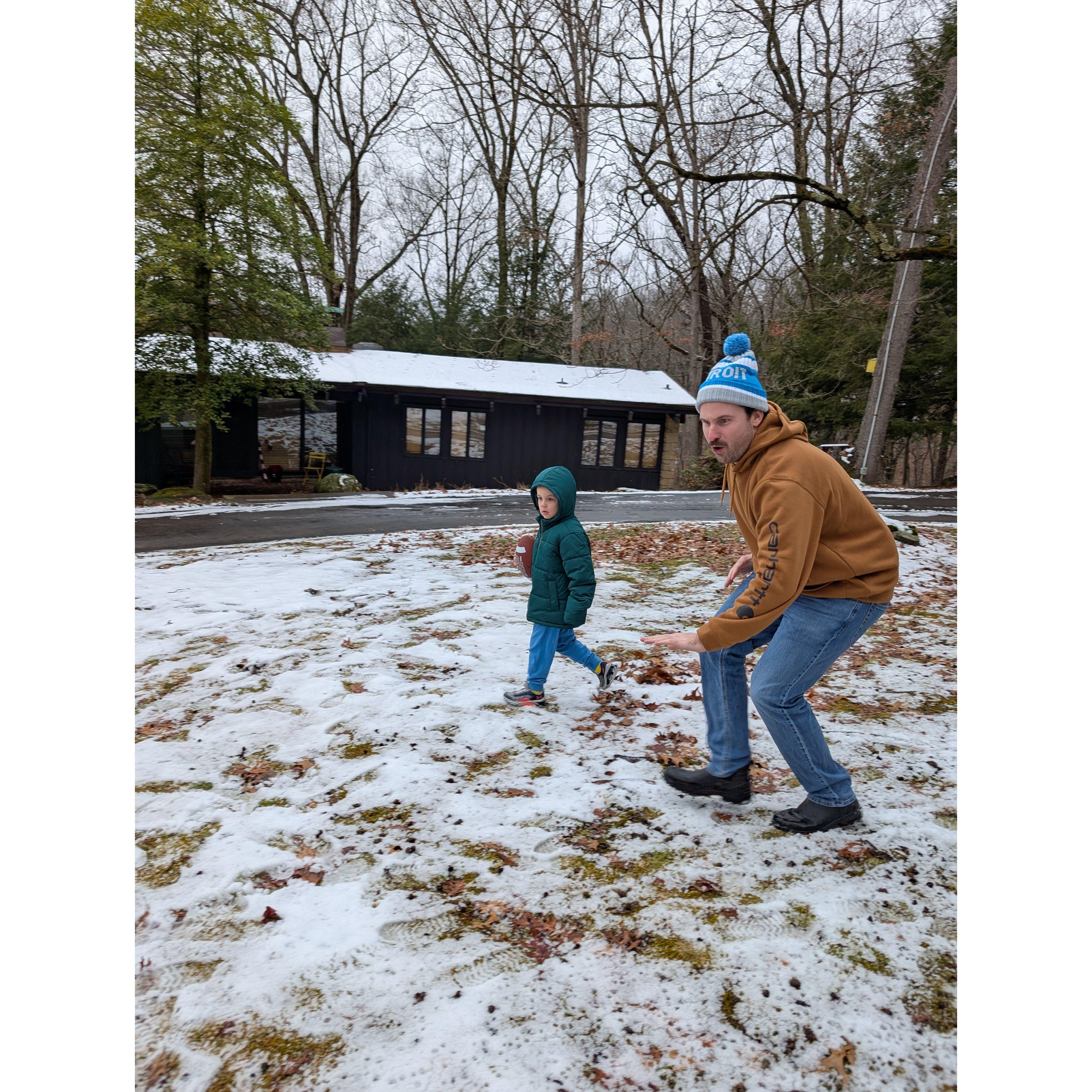 Tommy and Jack playing football outside of Oma's house. December 2024.