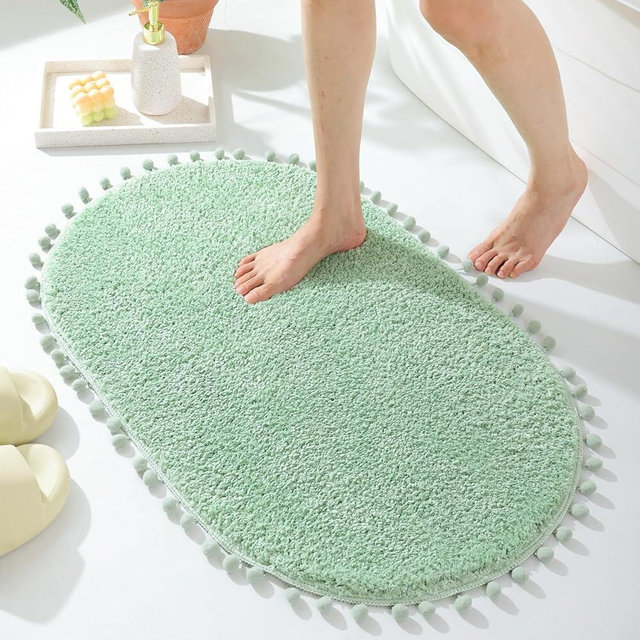 YIRDDEO Sage Green Pom Bath Rug for Bathroom Non Slip, Cute Boho Pom Oval Absorbent Shower Mat, Plush Soft Washable Rug (20x30 inches)