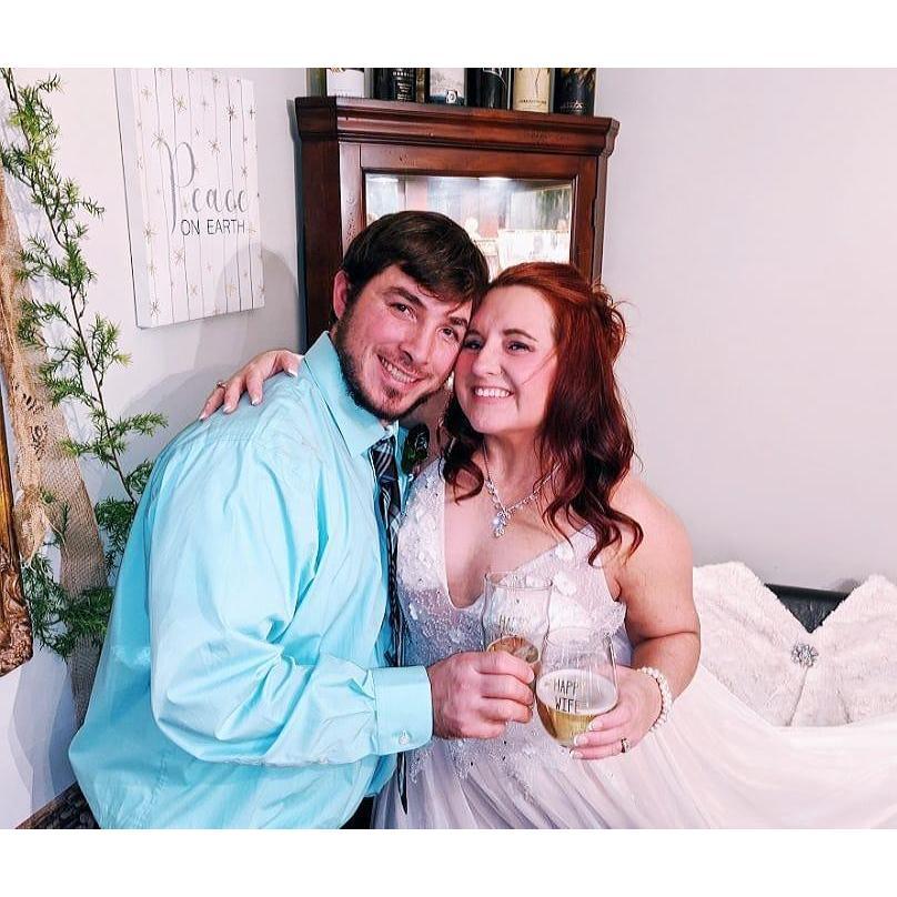A toast with their "Happy Wife" "Happy Life" glasses the groom found:)