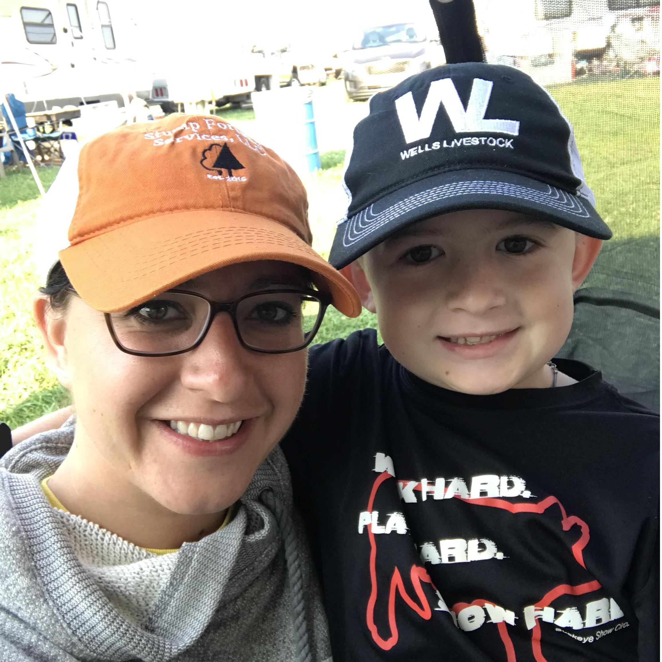 Learning what fair week together is all about with a 4-H Educator and a boy showing two species!