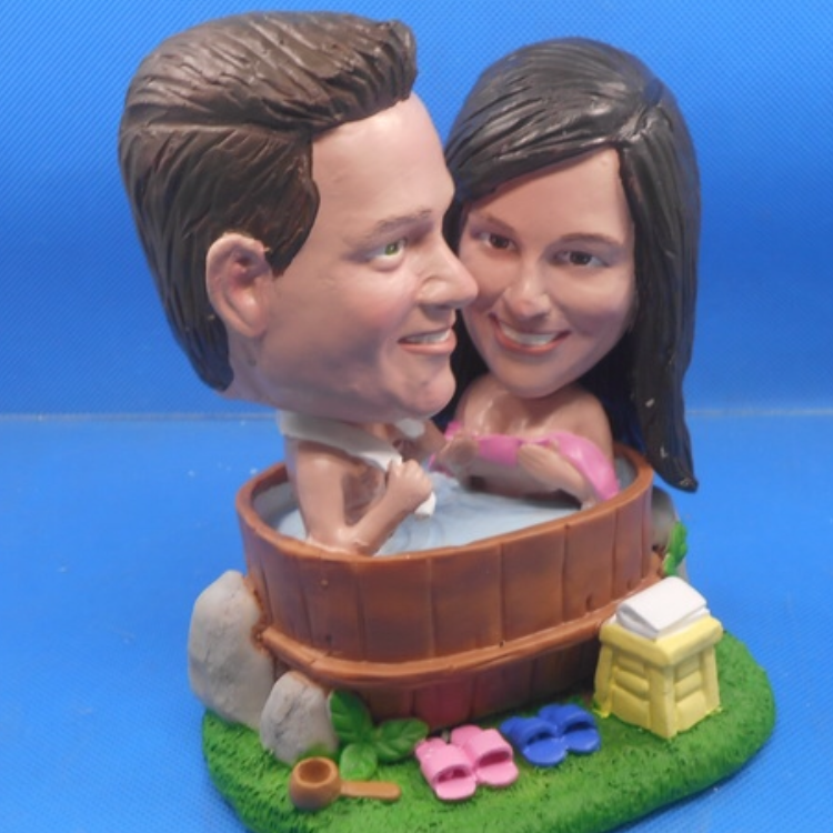 The lovebirds in the hot tub! Hmmm...or is that just a bobble head of the two of them?