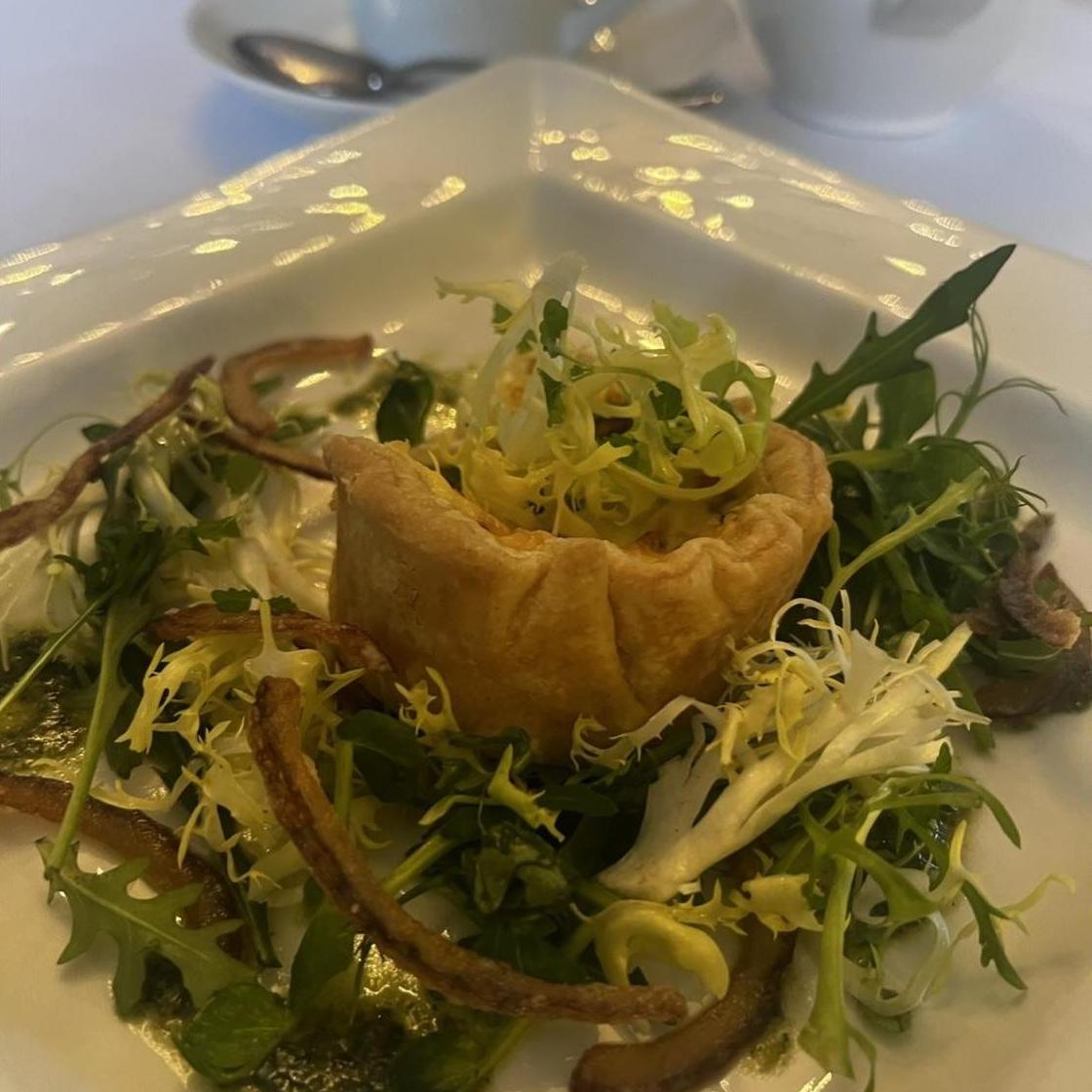 Vegetarian starter: Herritage tomato and Montgomery cheddar tart, crispy red onion, basil pesto