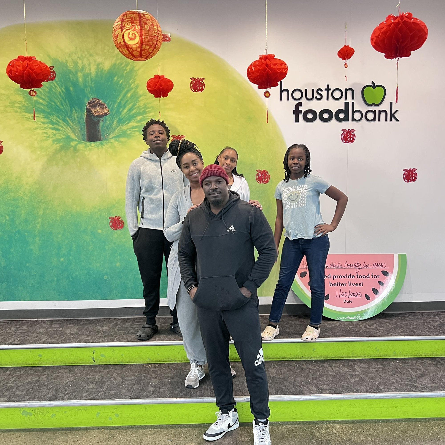 Volunteering at the Houston food bank with our kids!