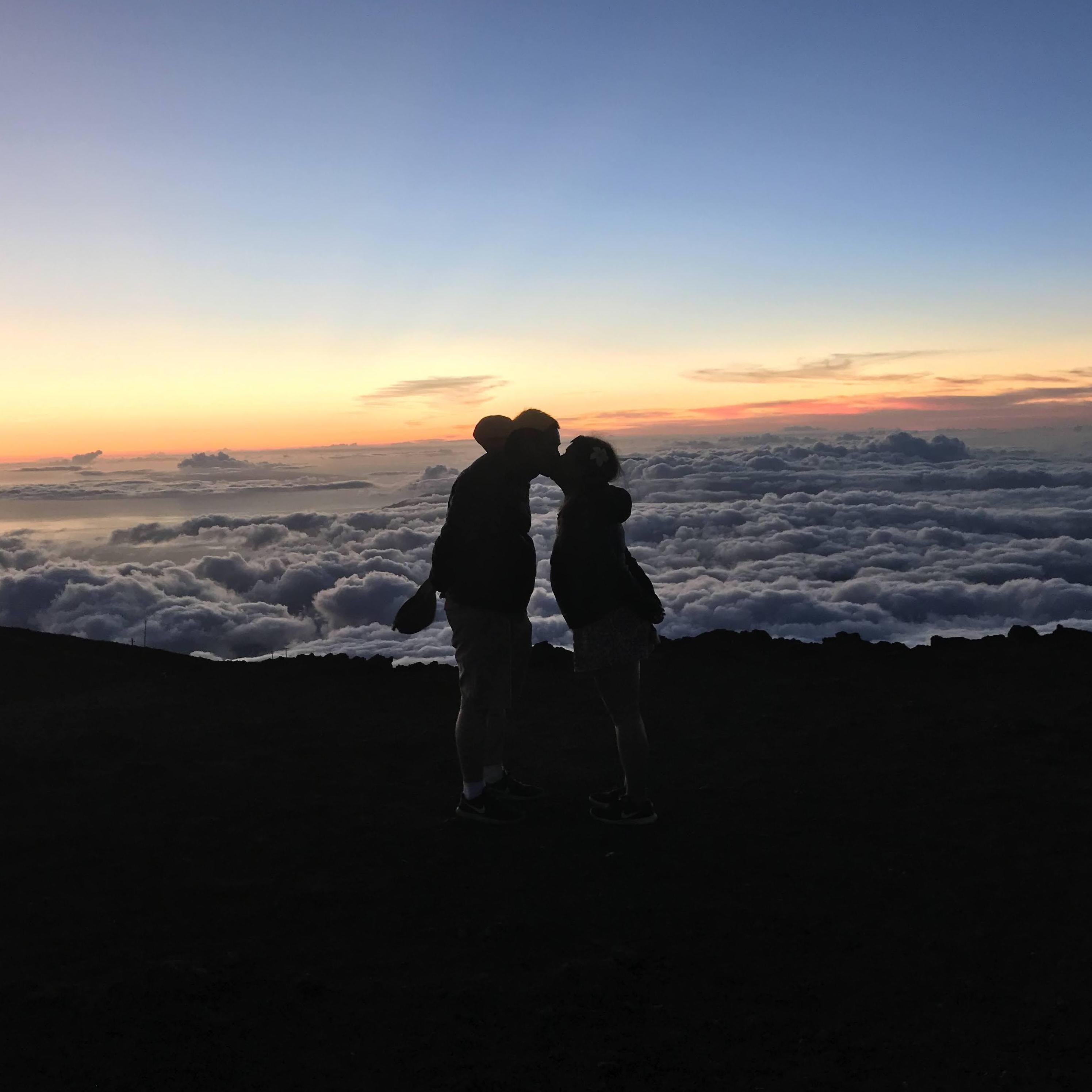 Watching the sunset above the clouds at Mt. Haleakalā in Maui, HI.