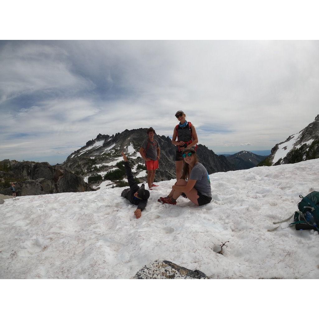 Ben and Eileen first meet when Jack (pictured laying in the snow) invited them both on a thru-hike of the Enchantment Range in Washington.