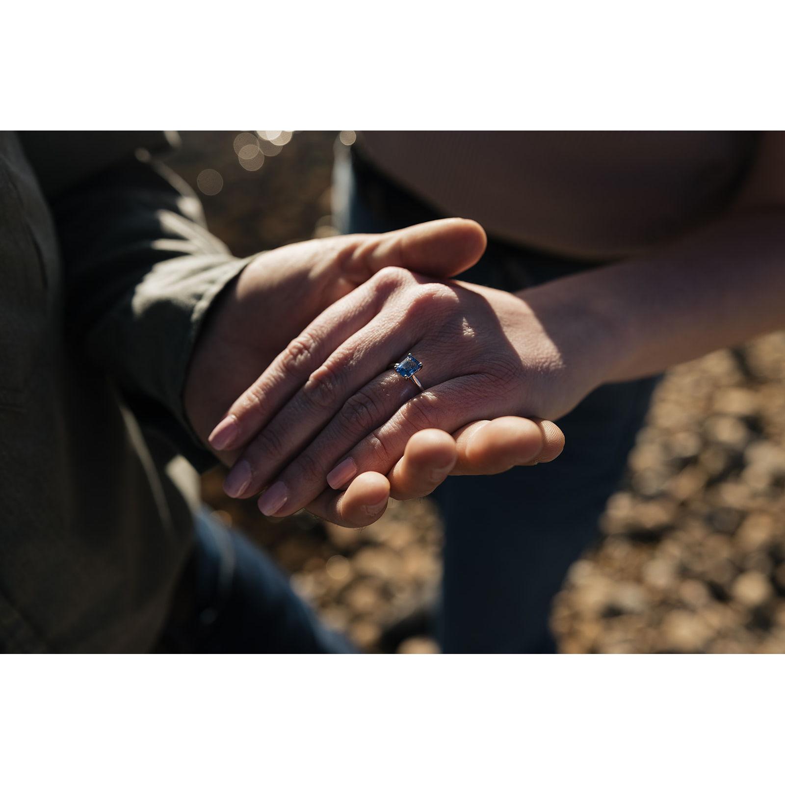 Kelly's ring is a cornflower blue sapphire that Lane picked out working with his talented aunt, Jacki Sappington.