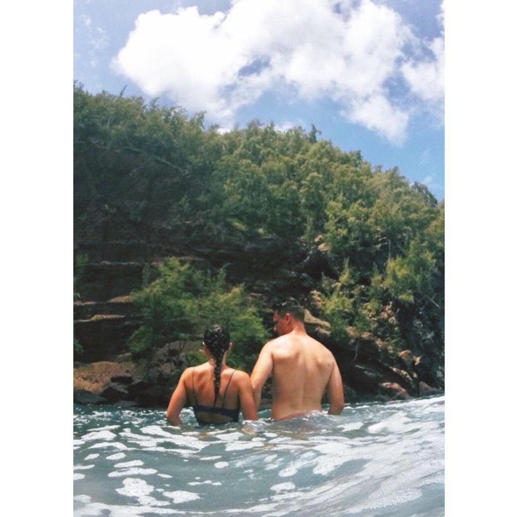 Swimming at Black Sand beach while traveling the ‘Road to Hana’