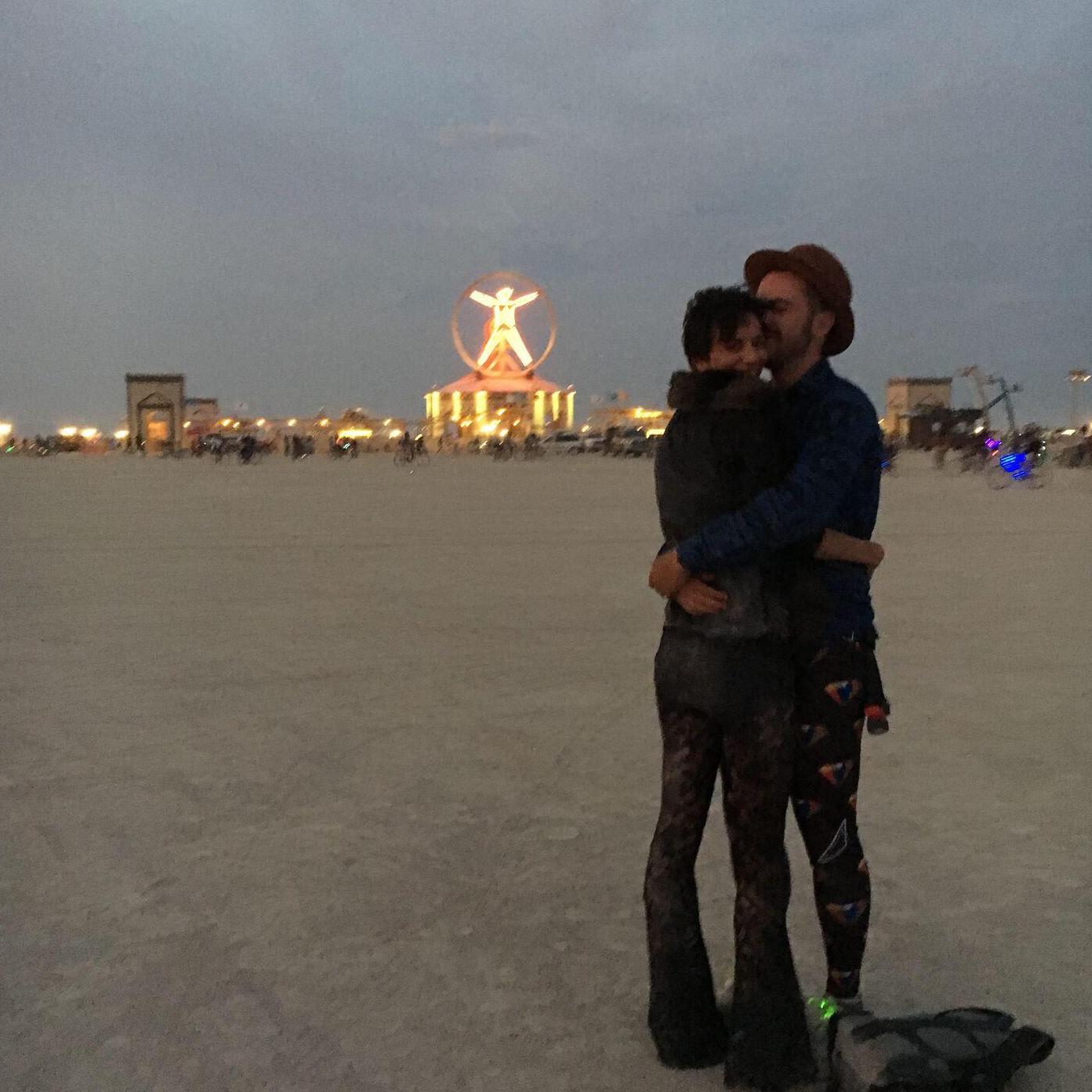 In front of the Man during our first trip to Burning Man together, in August 2016.