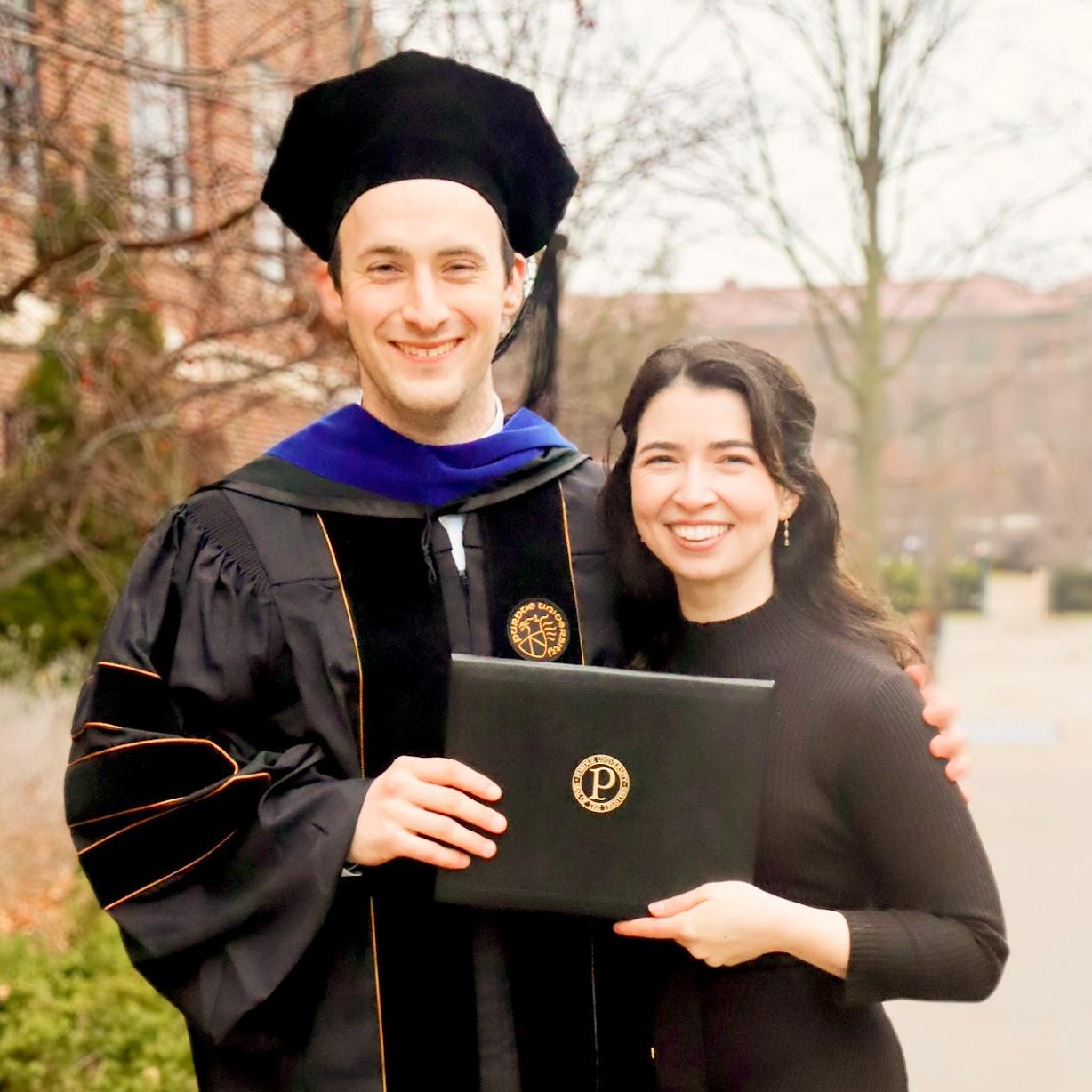 The day of Andrew's commencement to celebrate Dr. Mikes and his PhD in Chemical Engineering. Kathleen is also holding the degree because it would not have been possible without her.