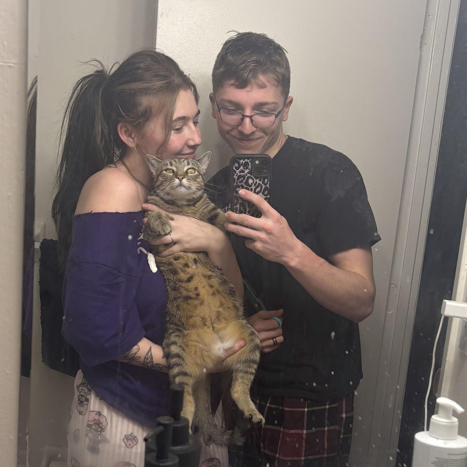 Bella, Derrick, and Miss in their first home