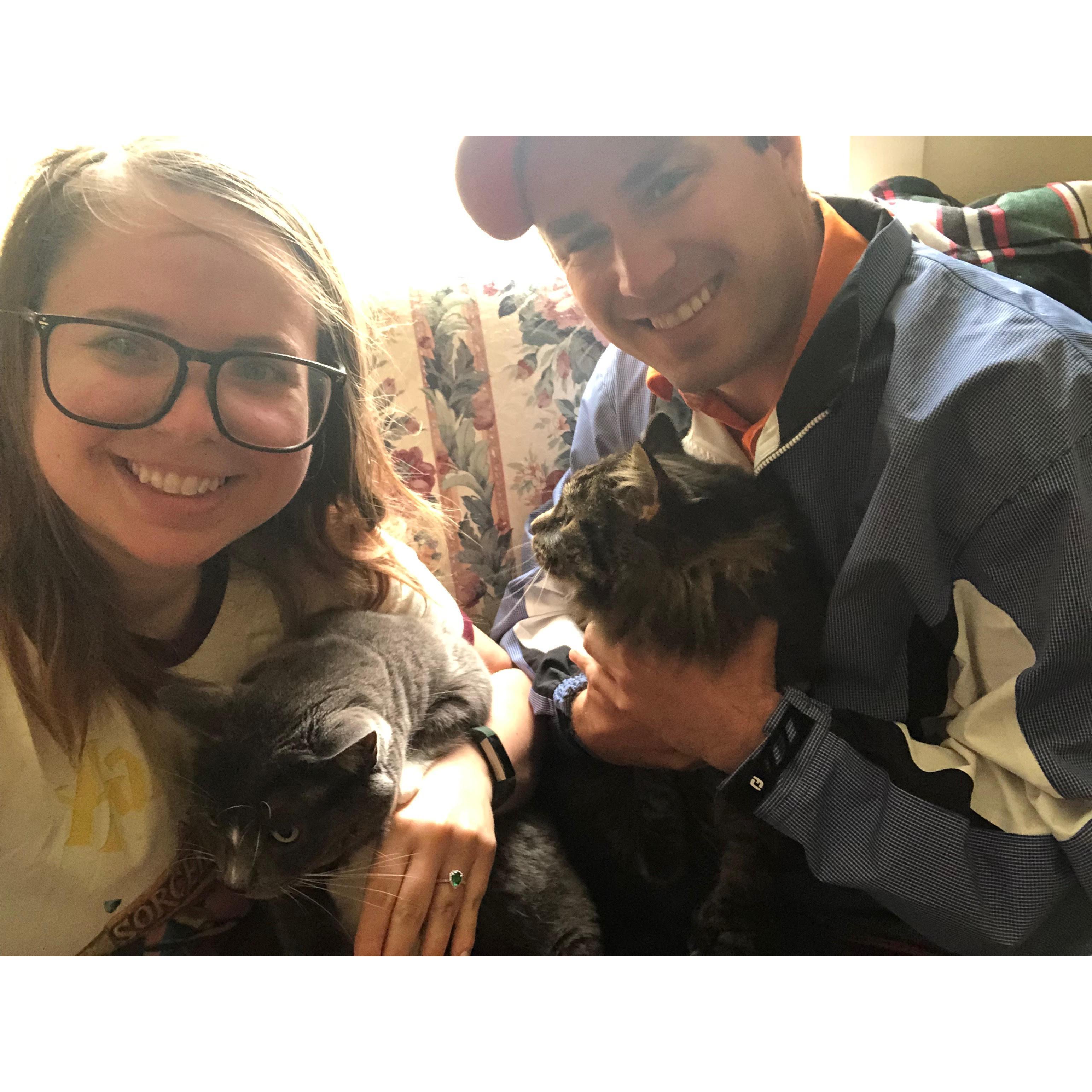 Our first official photo as an soon to be married couple and their cats.