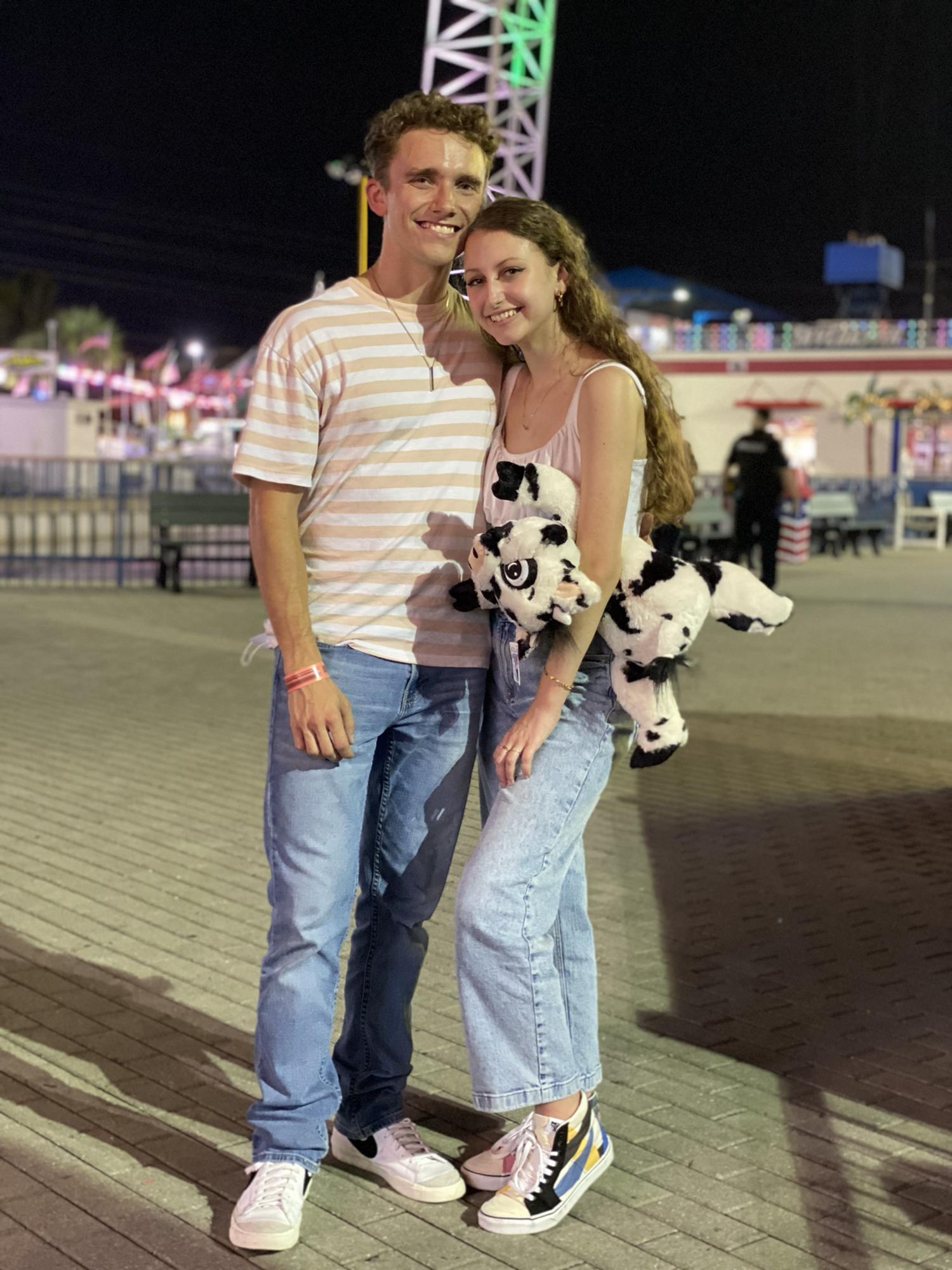 Dawson tried to win the cow for Spencer, but she beat him at the game and won it herself.