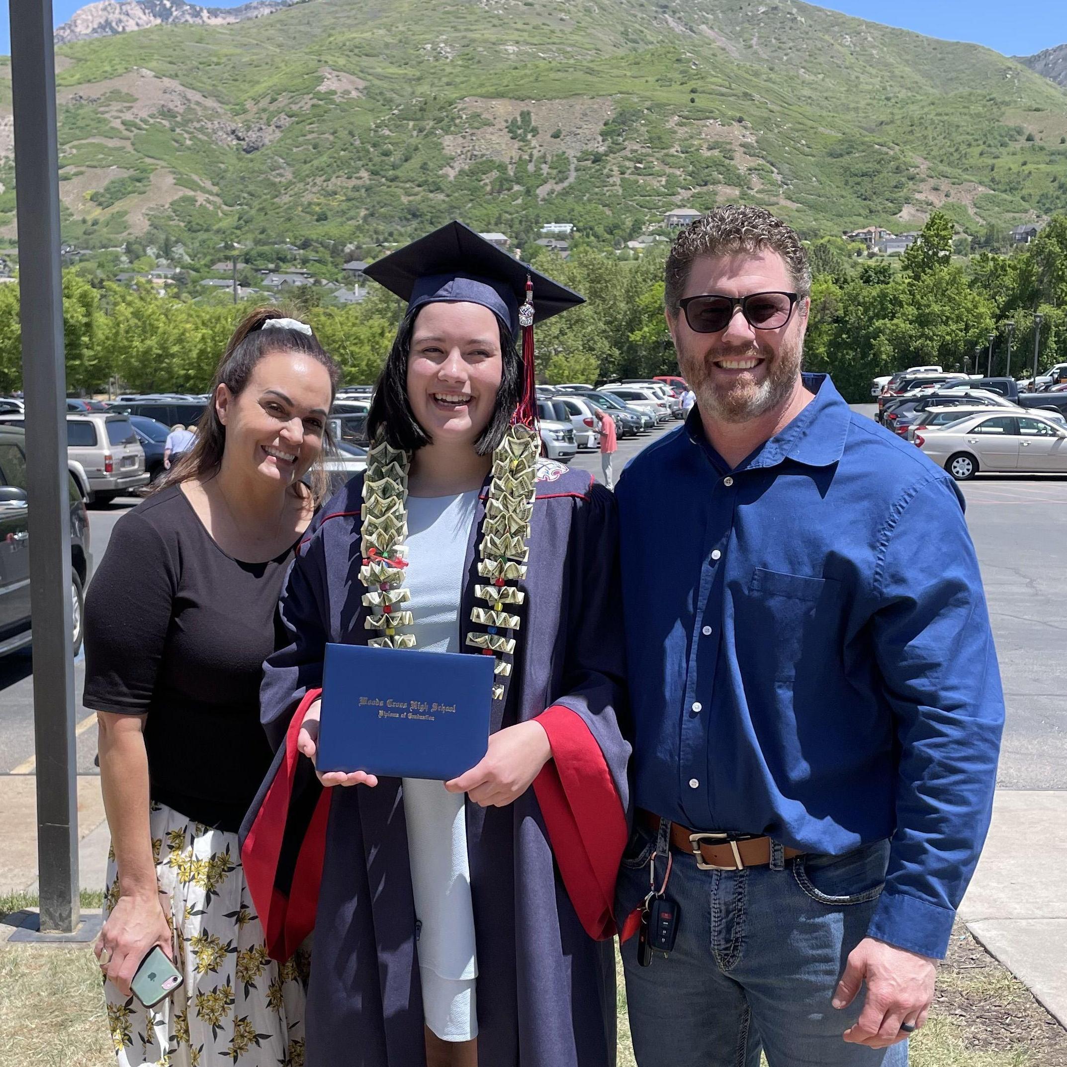 Highschool graduation 2022! Savannah and her parents.